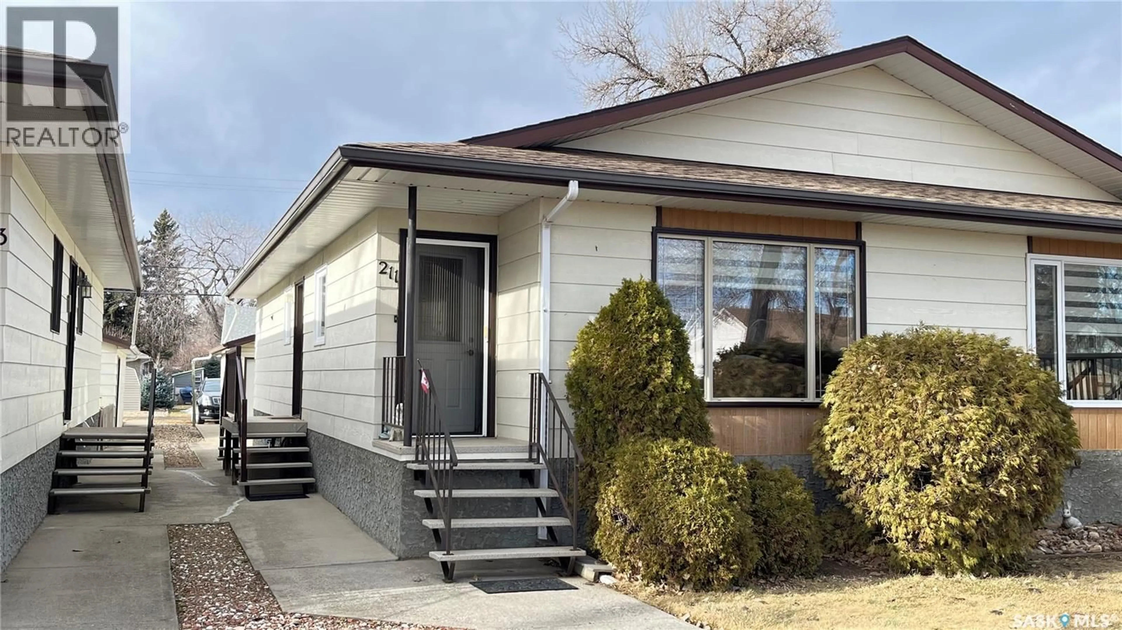 Home with vinyl exterior material, street for 211 MAPLE STREET, Maple Creek Saskatchewan S0N1N0