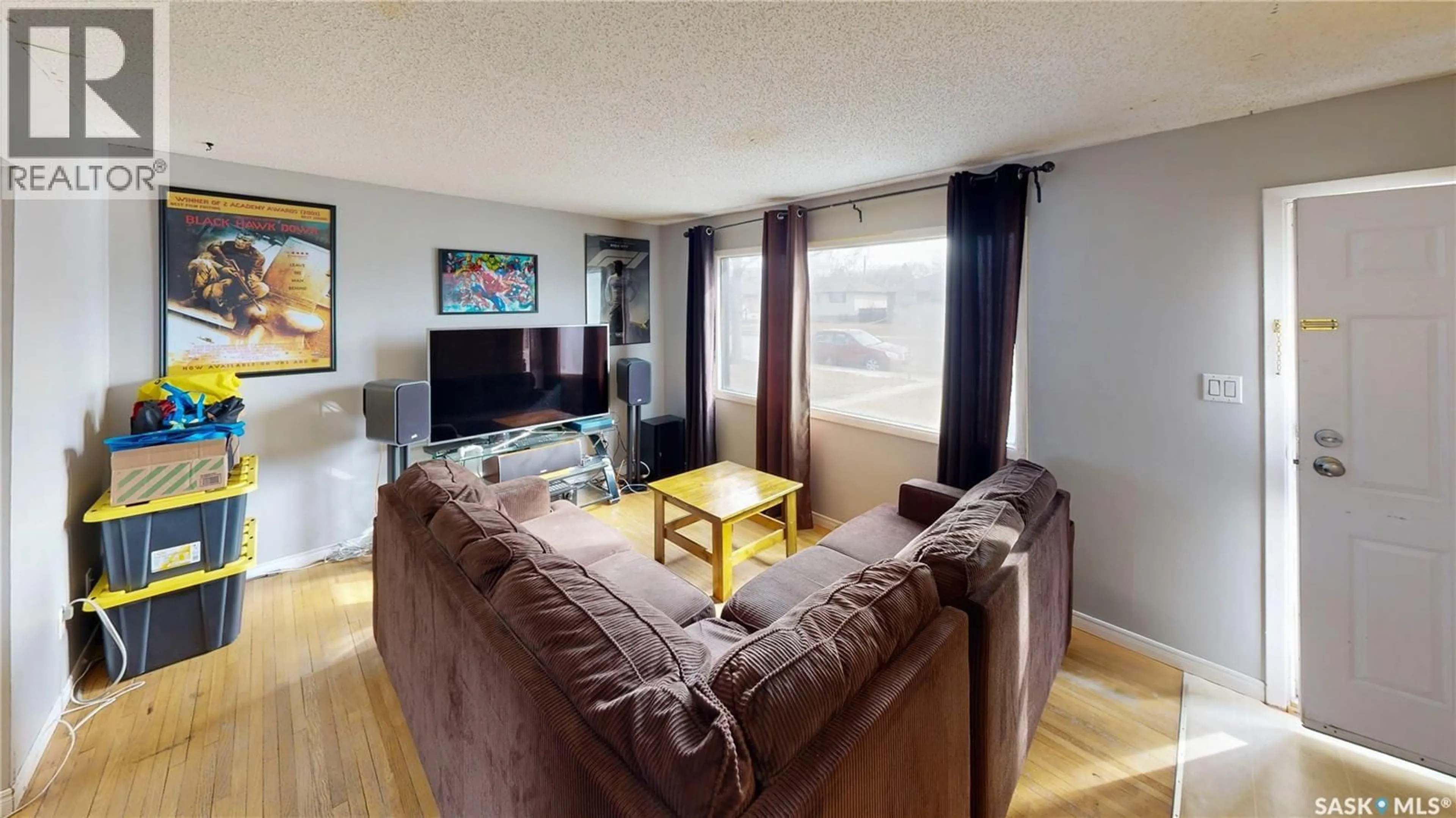 Living room with furniture, wood/laminate floor for 918 CAMPBELL STREET, Regina Saskatchewan S4T5P3