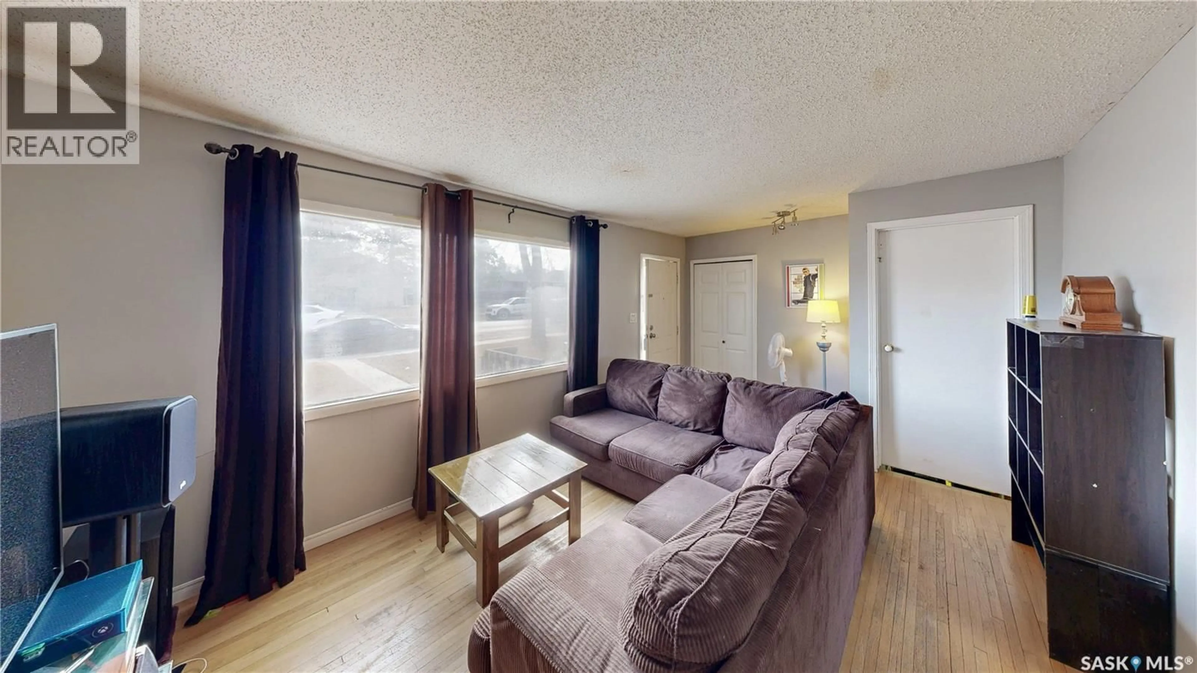 Living room with furniture, wood/laminate floor for 918 CAMPBELL STREET, Regina Saskatchewan S4T5P3