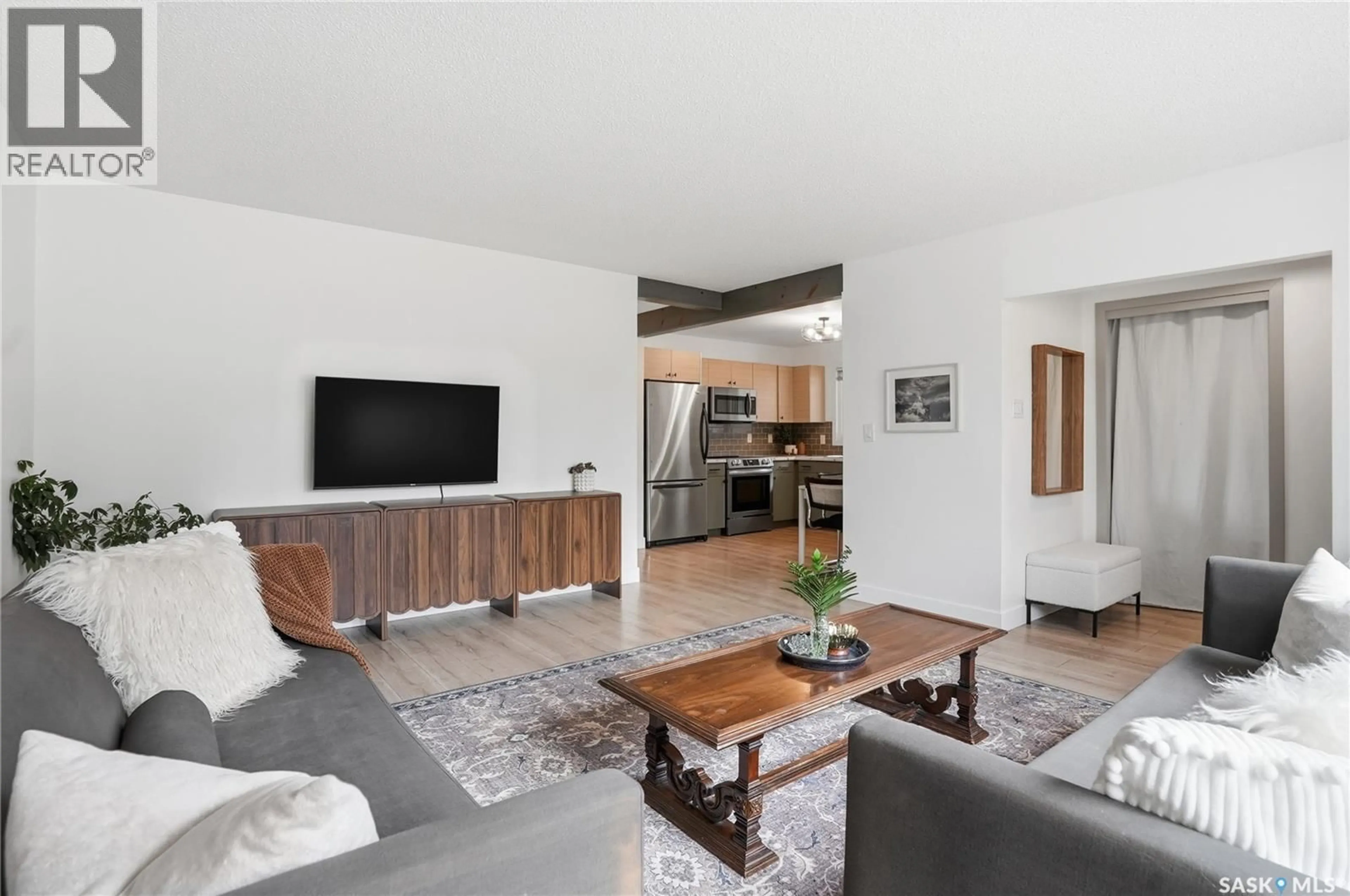 Living room with furniture, wood/laminate floor for 48 BELL CRESCENT, Saskatoon Saskatchewan S7J2W3