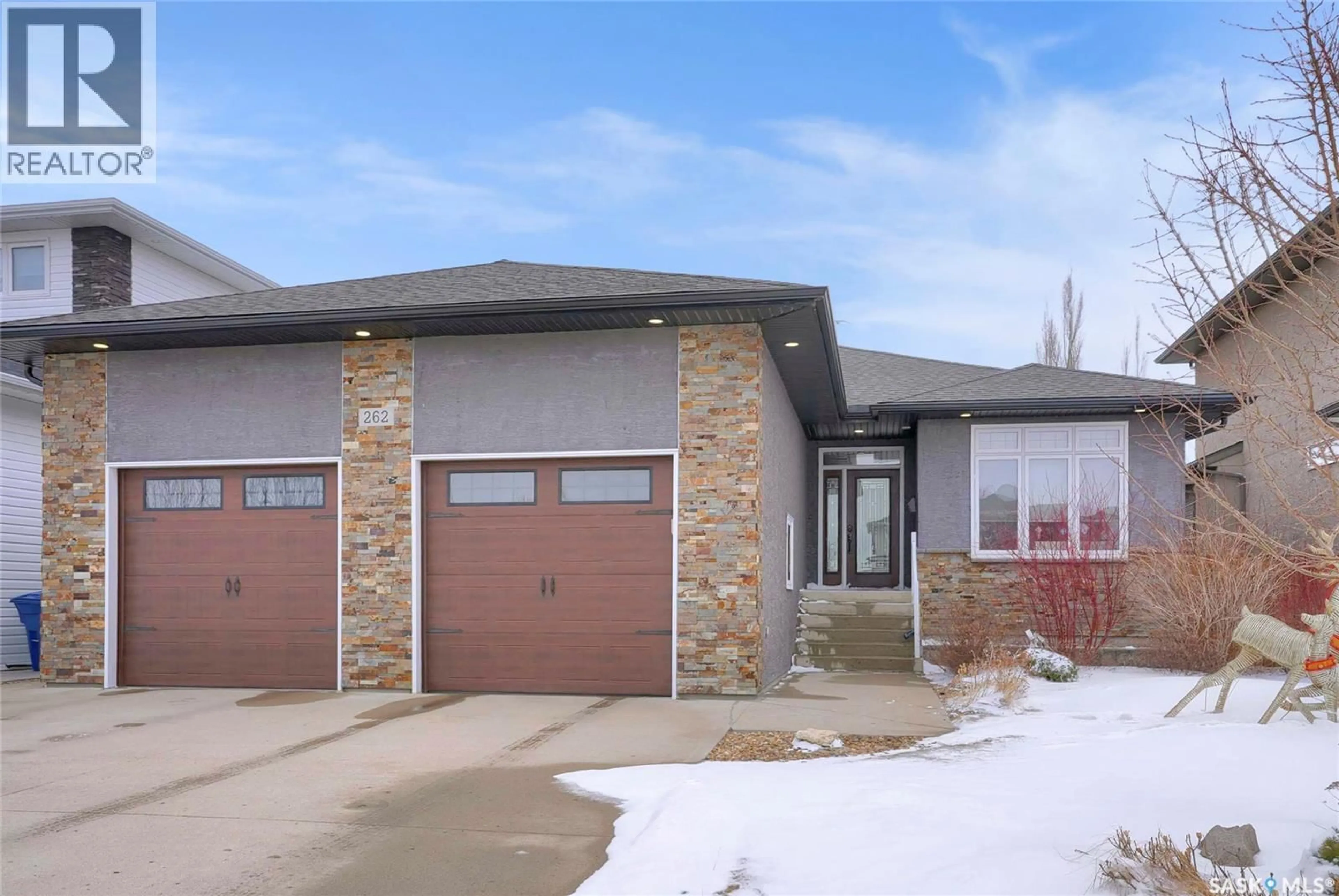 Home with brick exterior material, street for 262 BLUE SAGE DRIVE, Moose Jaw Saskatchewan S6J1N5