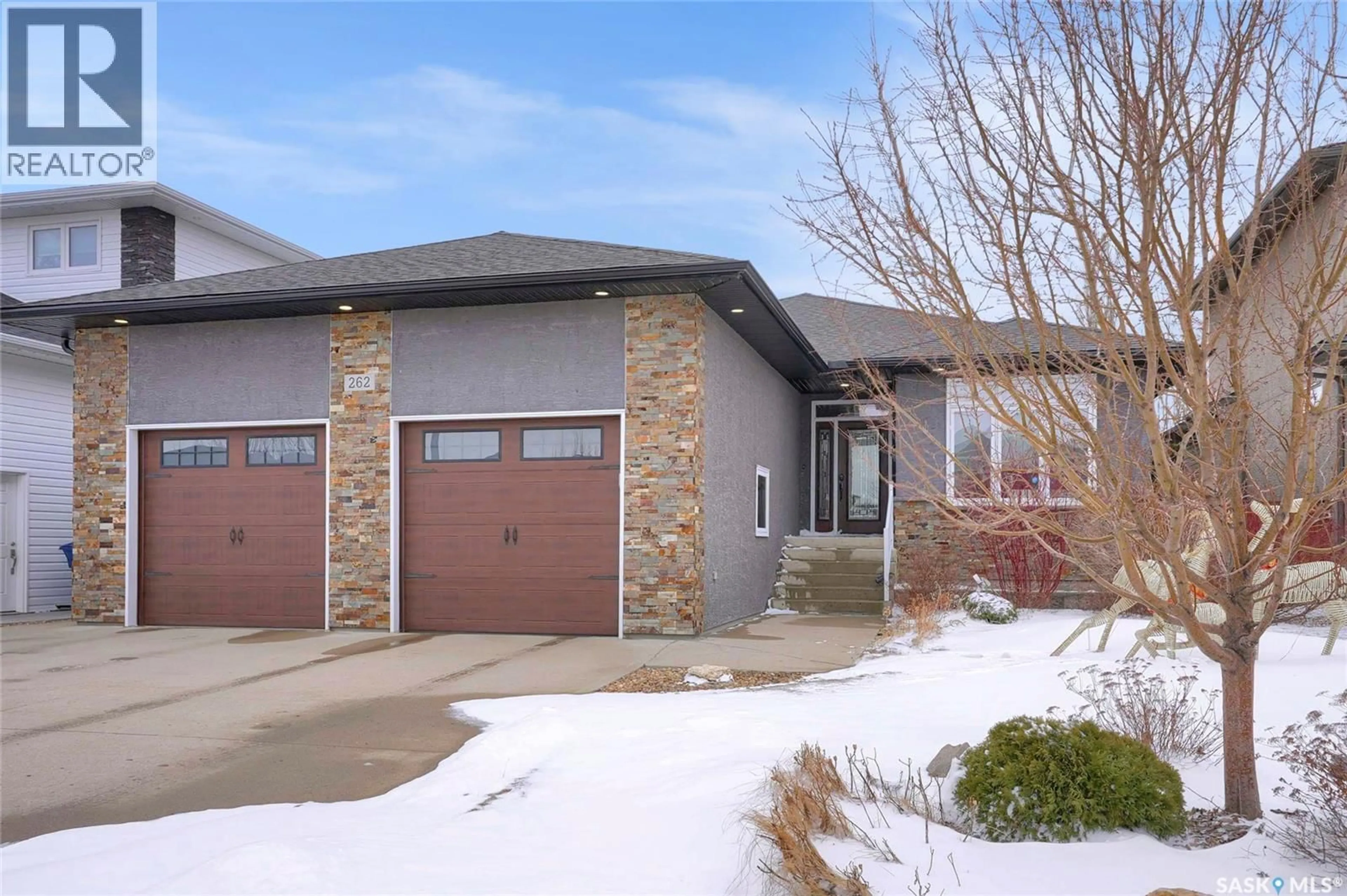 Home with brick exterior material, street for 262 BLUE SAGE DRIVE, Moose Jaw Saskatchewan S6J1N5