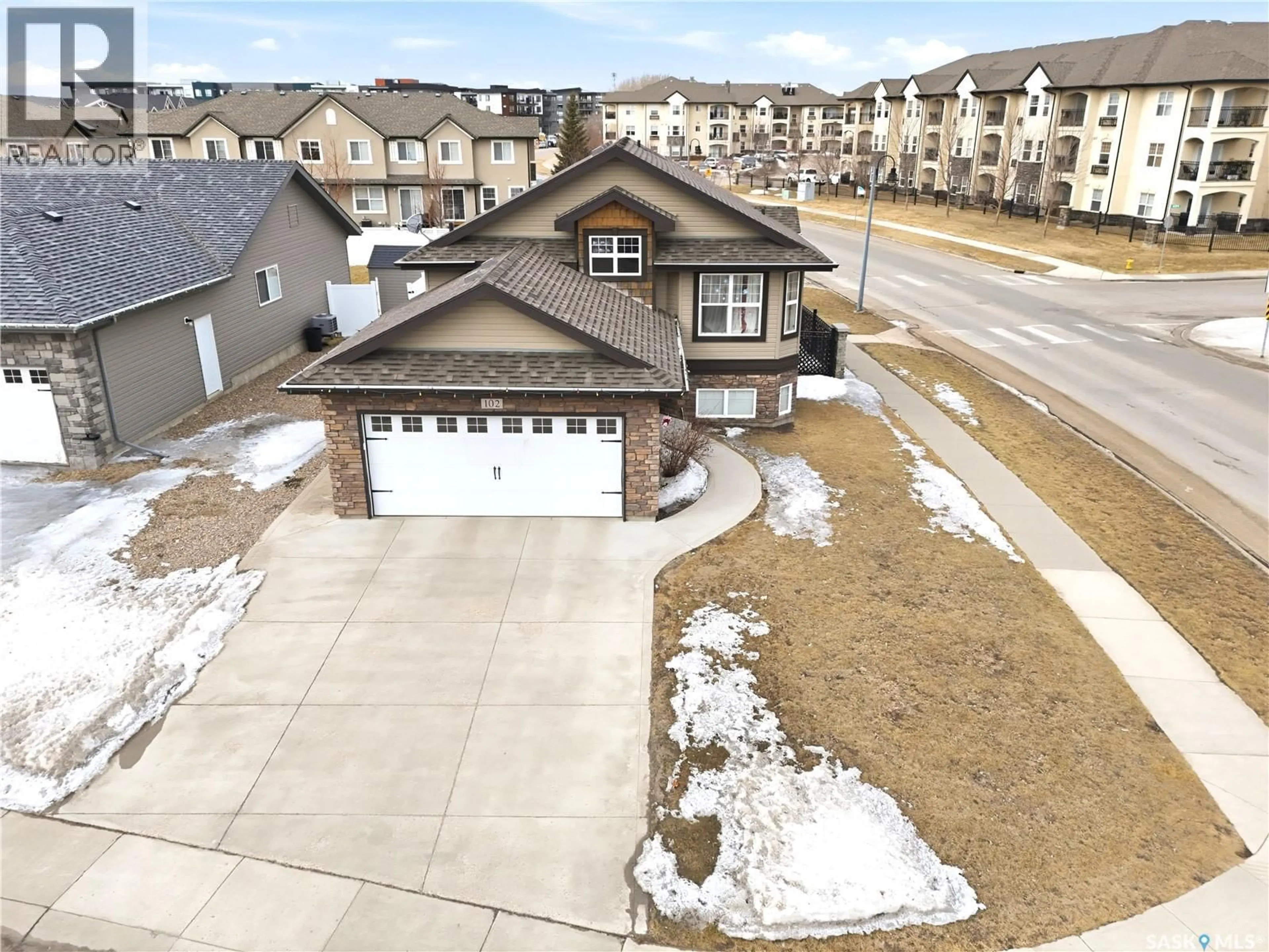 A pic from outside/outdoor area/front of a property/back of a property/a pic from drone, street for 102 WHALLEY CRESCENT, Saskatoon Saskatchewan S7T0H9