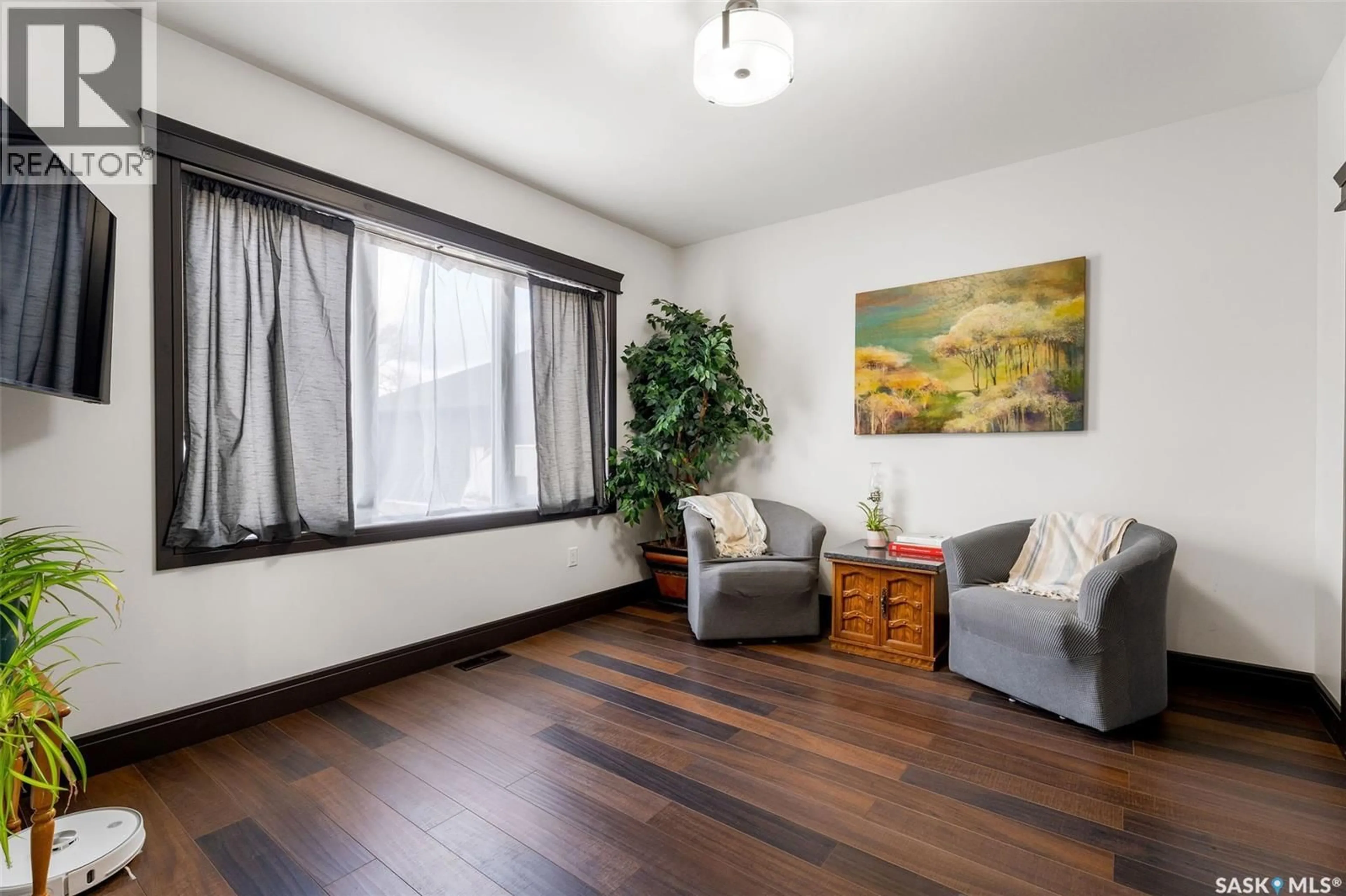 Living room with furniture, wood/laminate floor for 7 PAPE DRIVE, Wolverine Rm No. 340 Saskatchewan S0K2A0