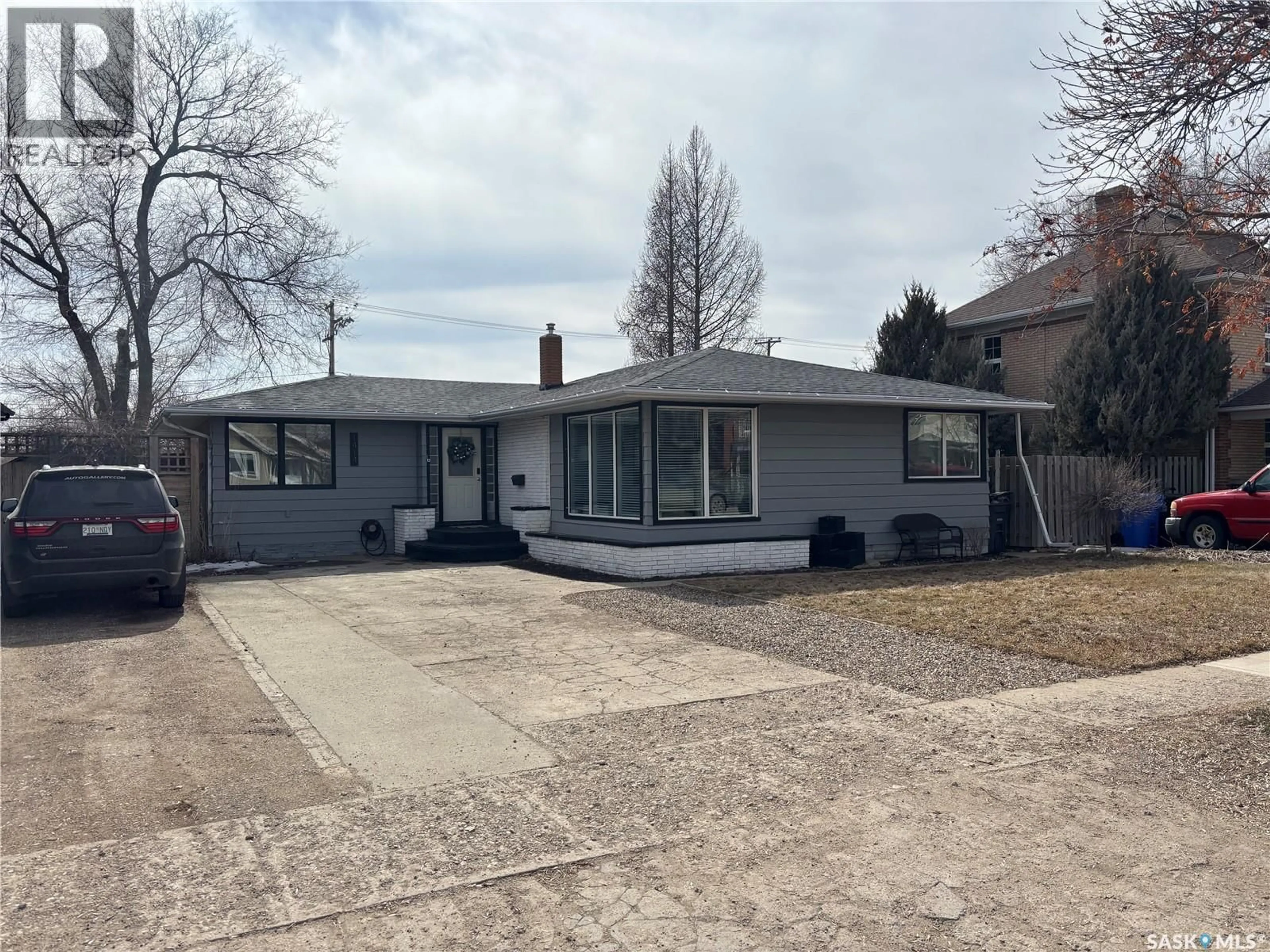 Home with vinyl exterior material, street for 1414 2ND STREET, Estevan Saskatchewan S4A0M6