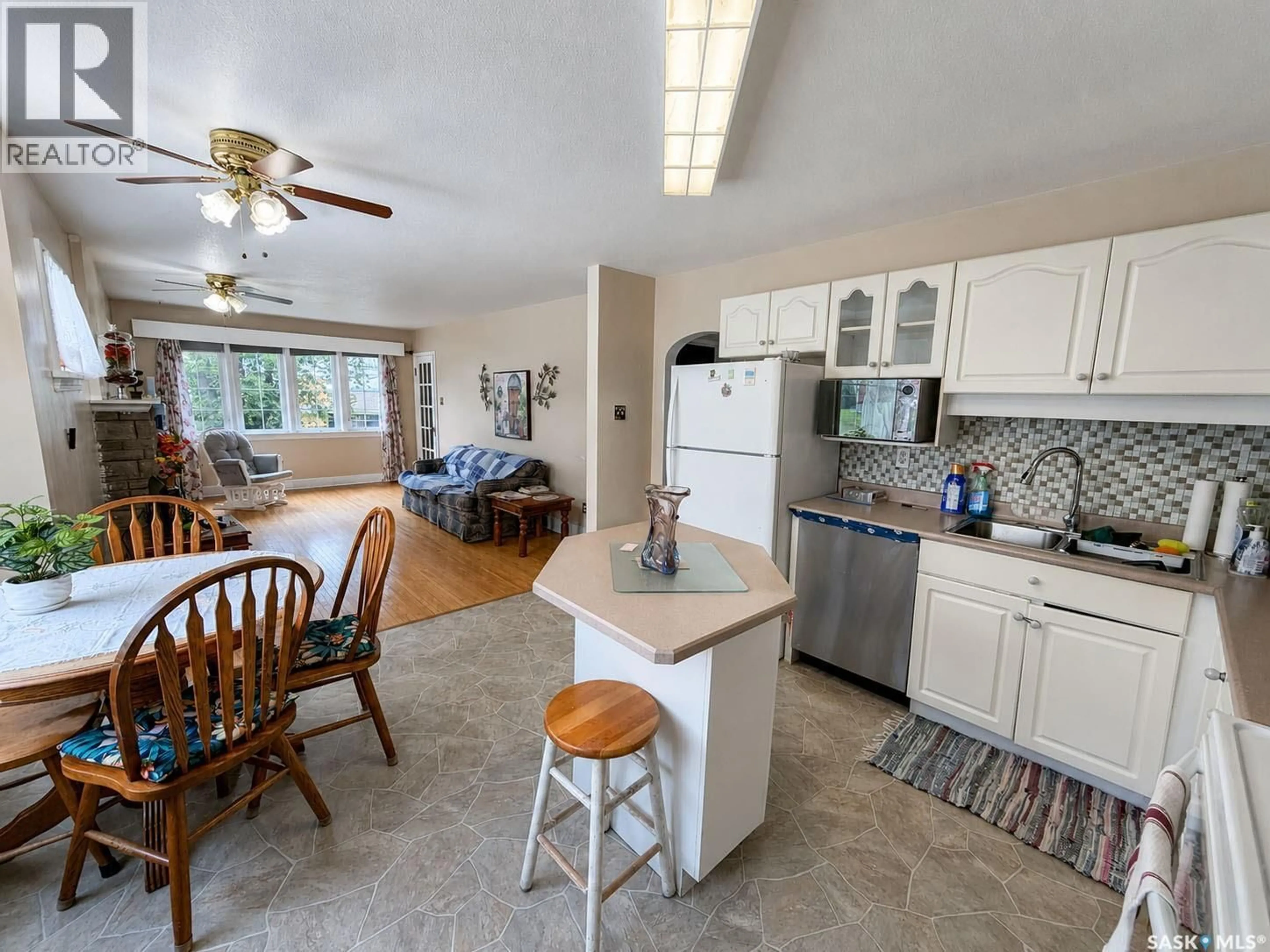 Open concept kitchen, ceramic/tile floor for 385 19TH STREET, Prince Albert Saskatchewan S6V4C8