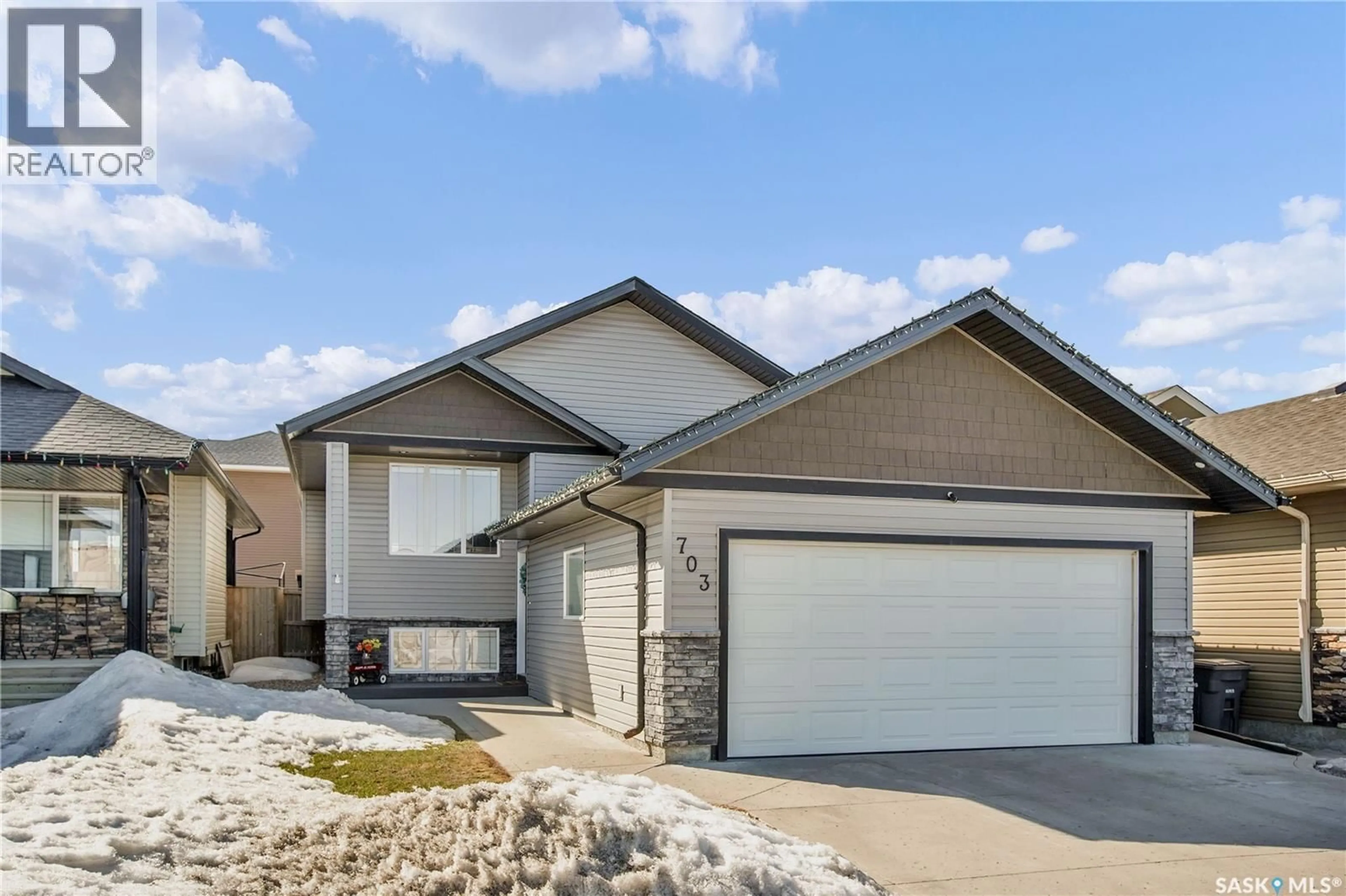 Home with vinyl exterior material, street for 703 GOWAN ROAD, Warman Saskatchewan S0K4S2