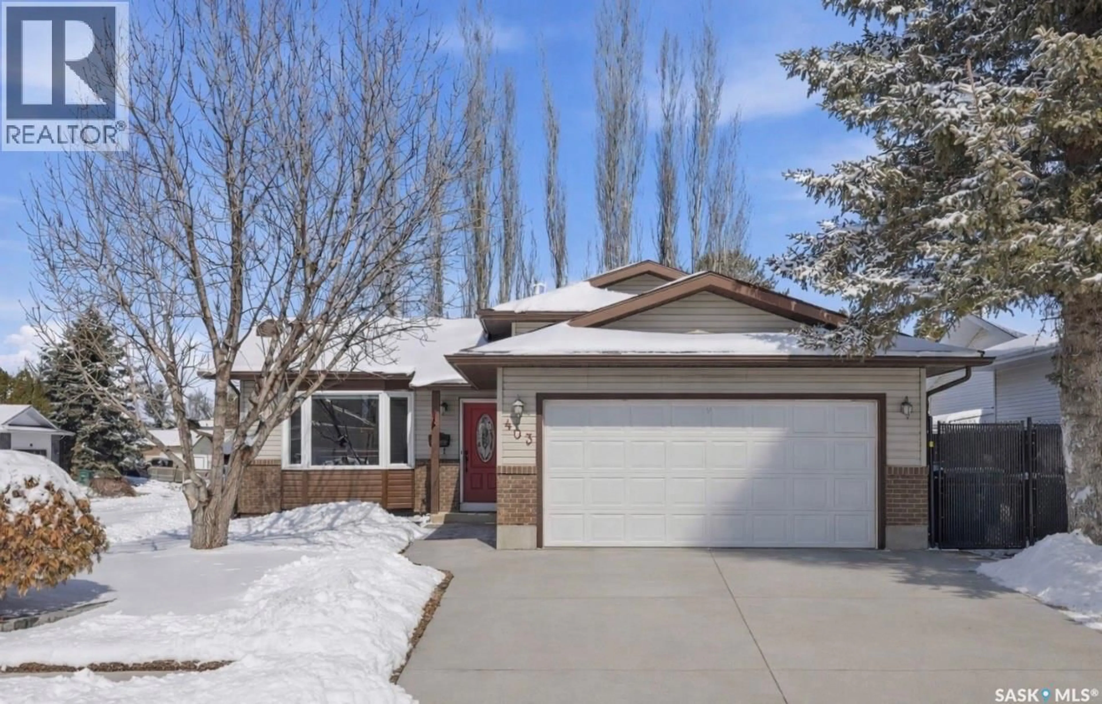 Home with vinyl exterior material, street for 403 BRONSON CRESCENT, Saskatoon Saskatchewan S7J5E2