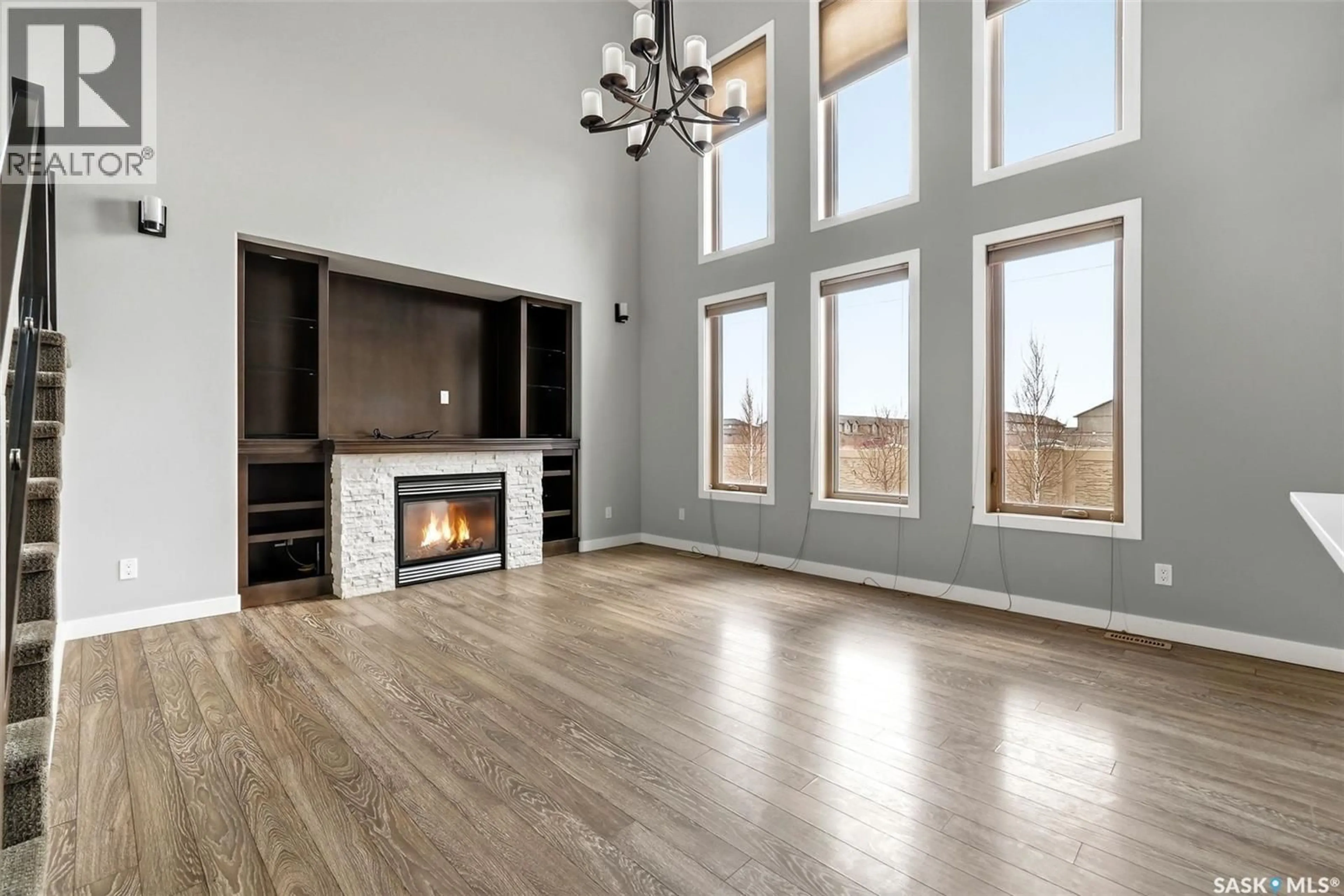 Living room with furniture, wood/laminate floor for 3825 GREEN MOSS BAY, Regina Saskatchewan S4V1P7