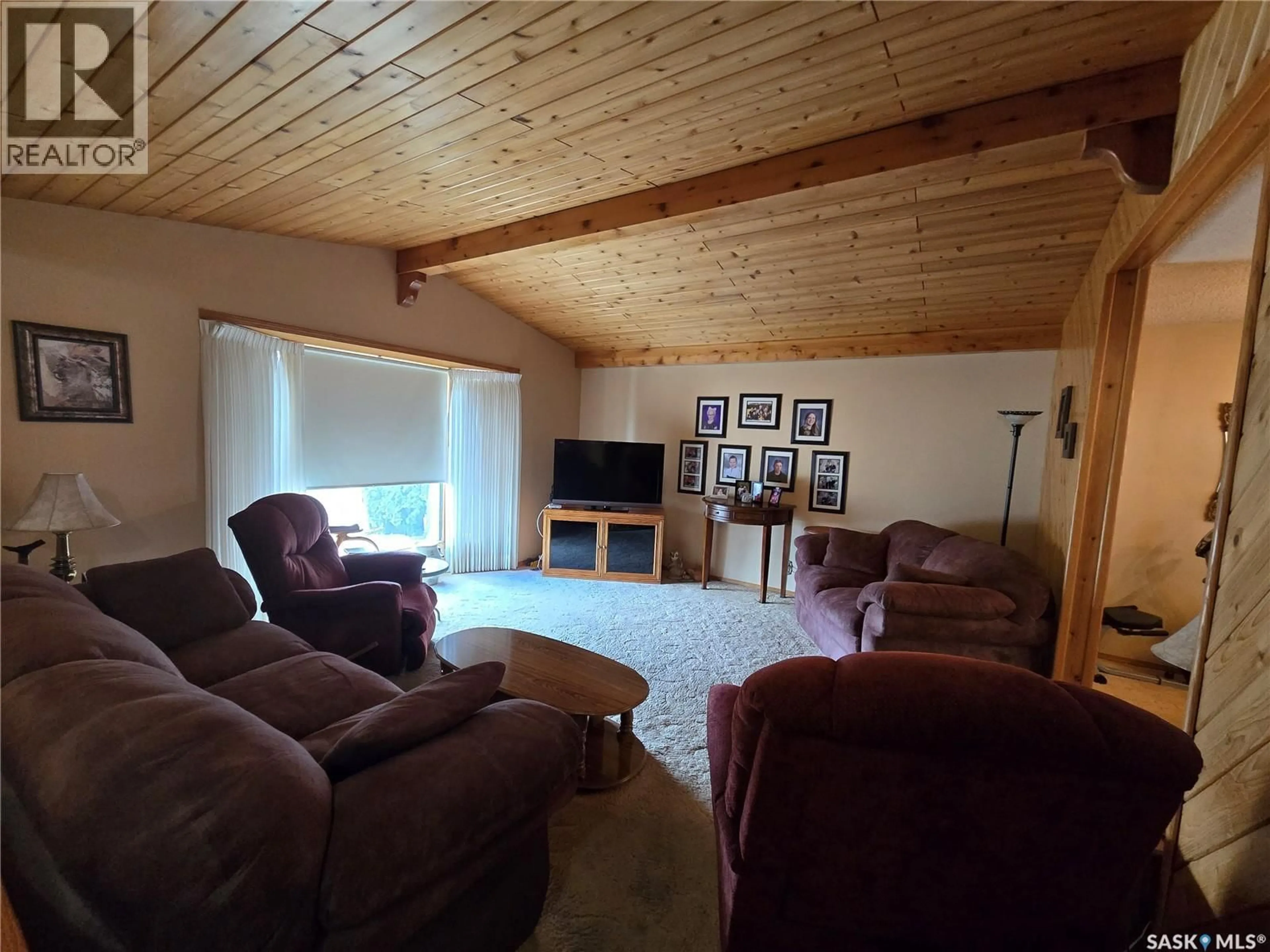 Living room with furniture, wood/laminate floor for 474 STEELE CRESCENT, Swift Current Saskatchewan S9H4P9