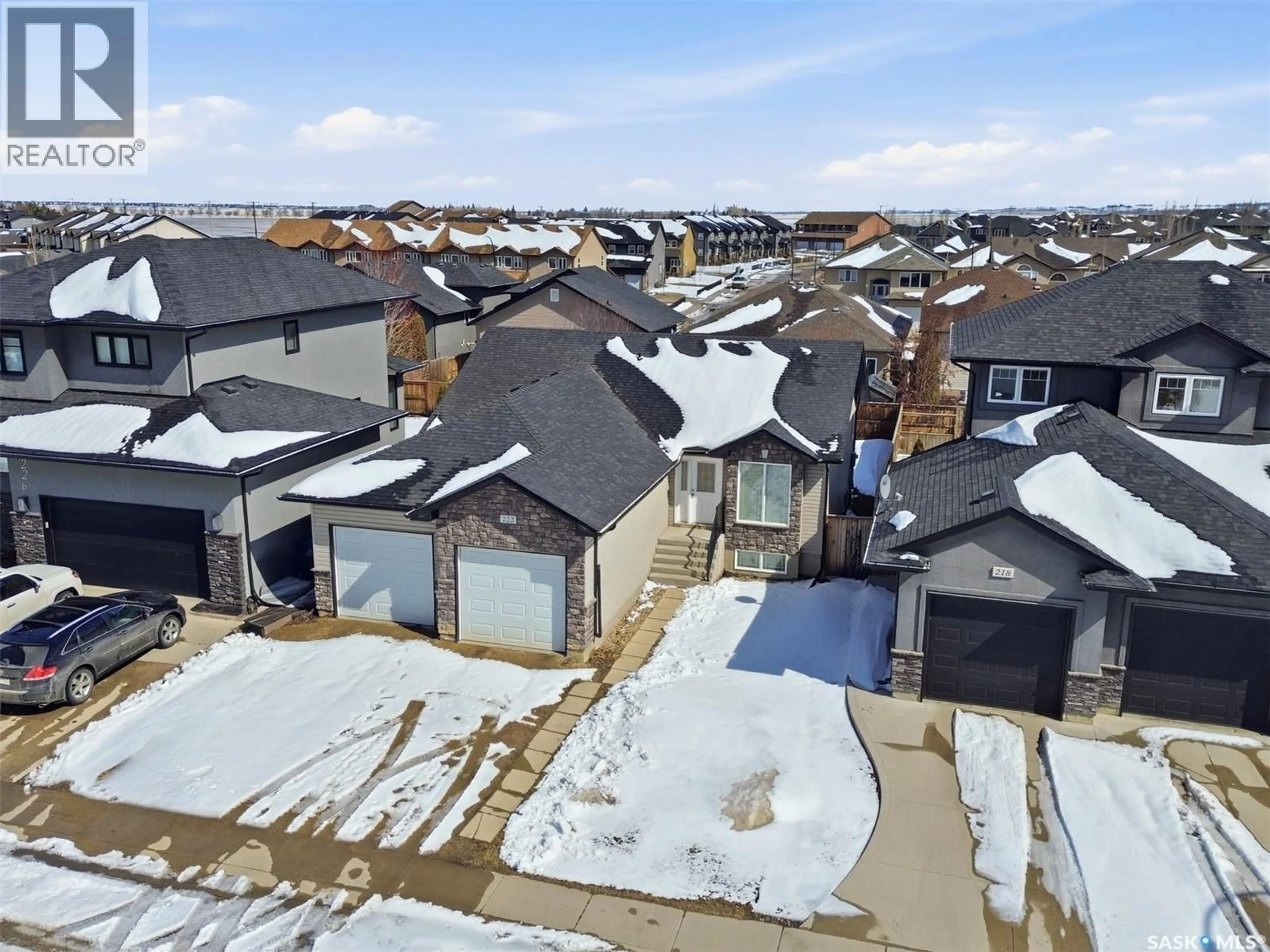 A pic from outside/outdoor area/front of a property/back of a property/a pic from drone, street for 222 FLEMING CRESCENT, Saskatoon Saskatchewan S7W0E7