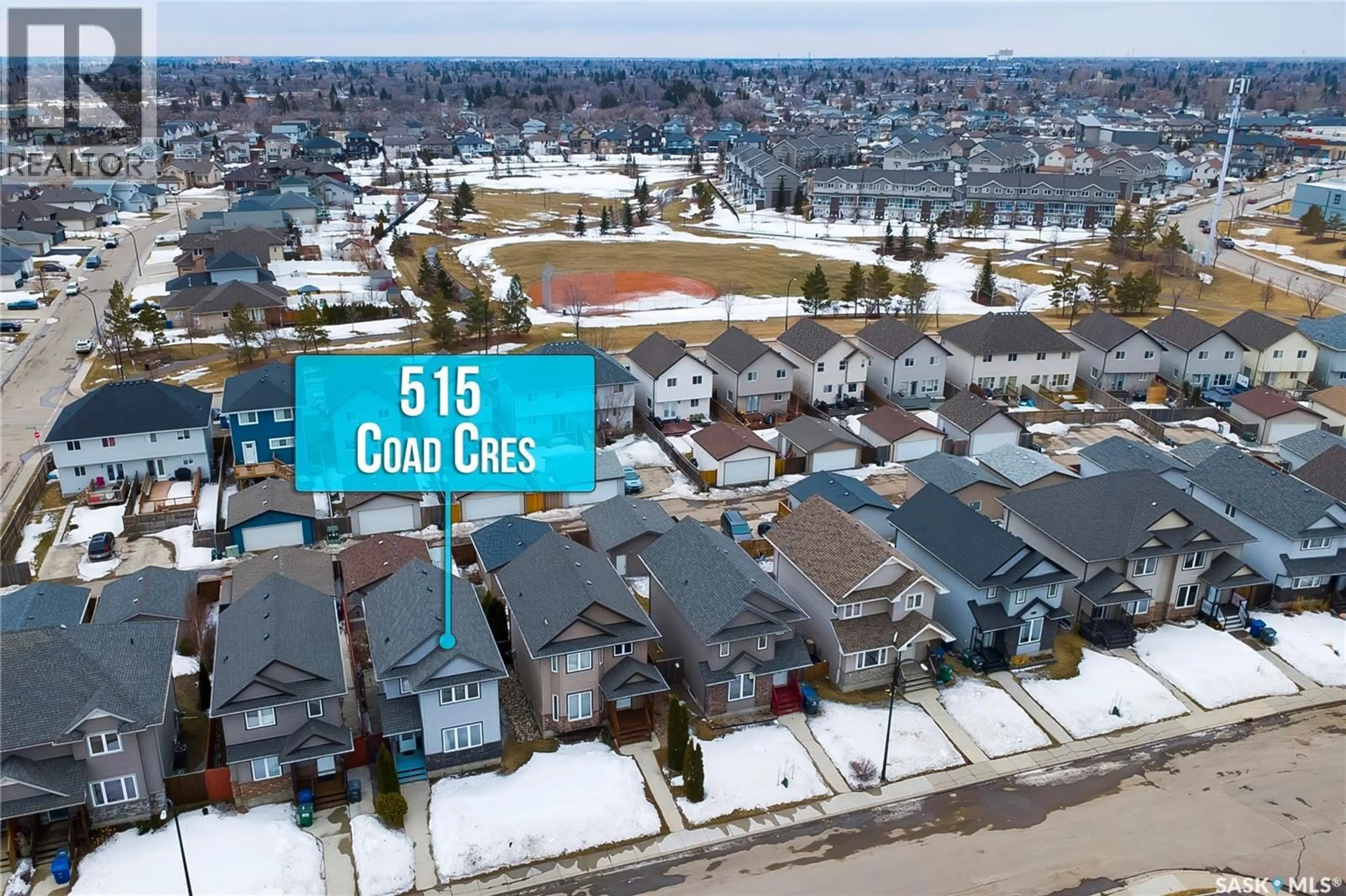 A pic from outside/outdoor area/front of a property/back of a property/a pic from drone, street for 515 COAD CRESCENT, Saskatoon Saskatchewan S7R0A7