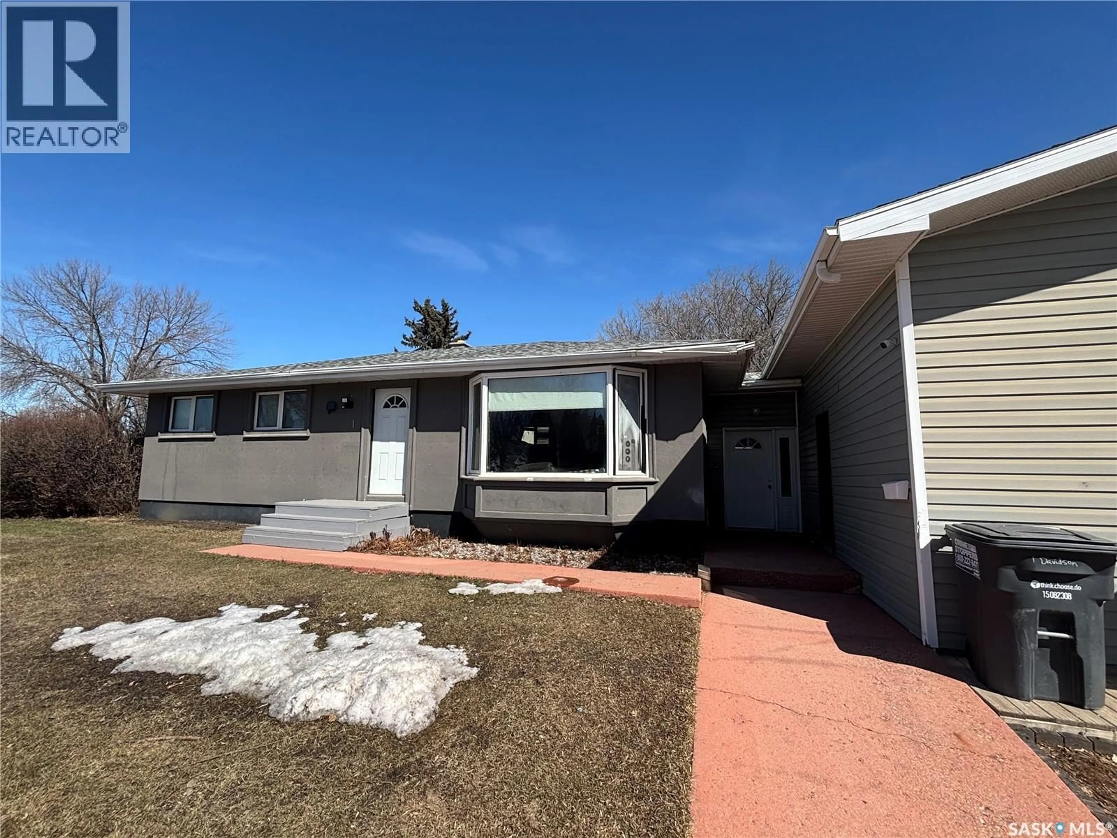 Home with vinyl exterior material, street for 1 DAVIDSON CRESCENT, Saskatoon Saskatchewan S7L3Z9