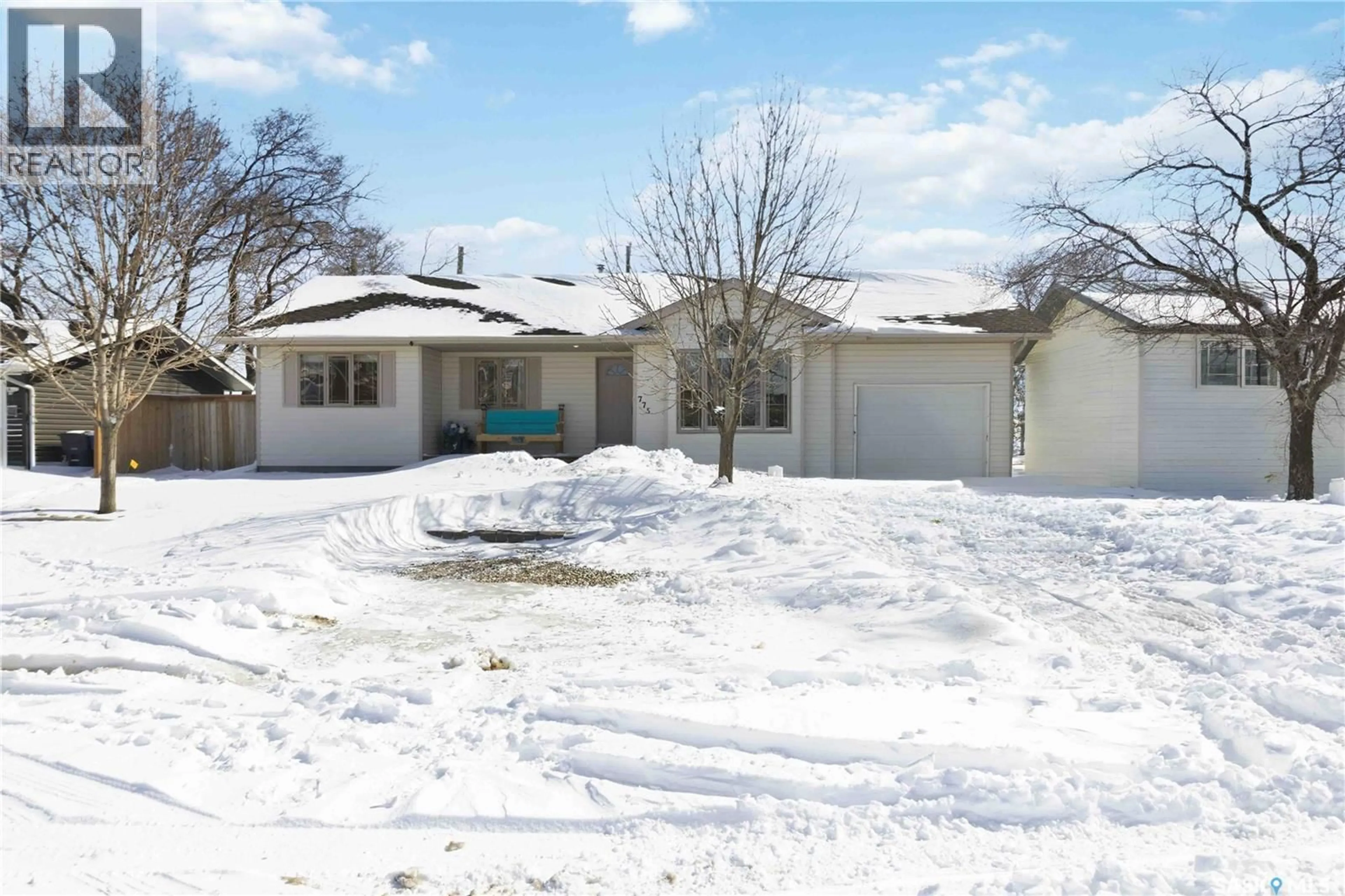 Home with vinyl exterior material, street for 775 1ST AVENUE, Martensville Saskatchewan S0K2T2