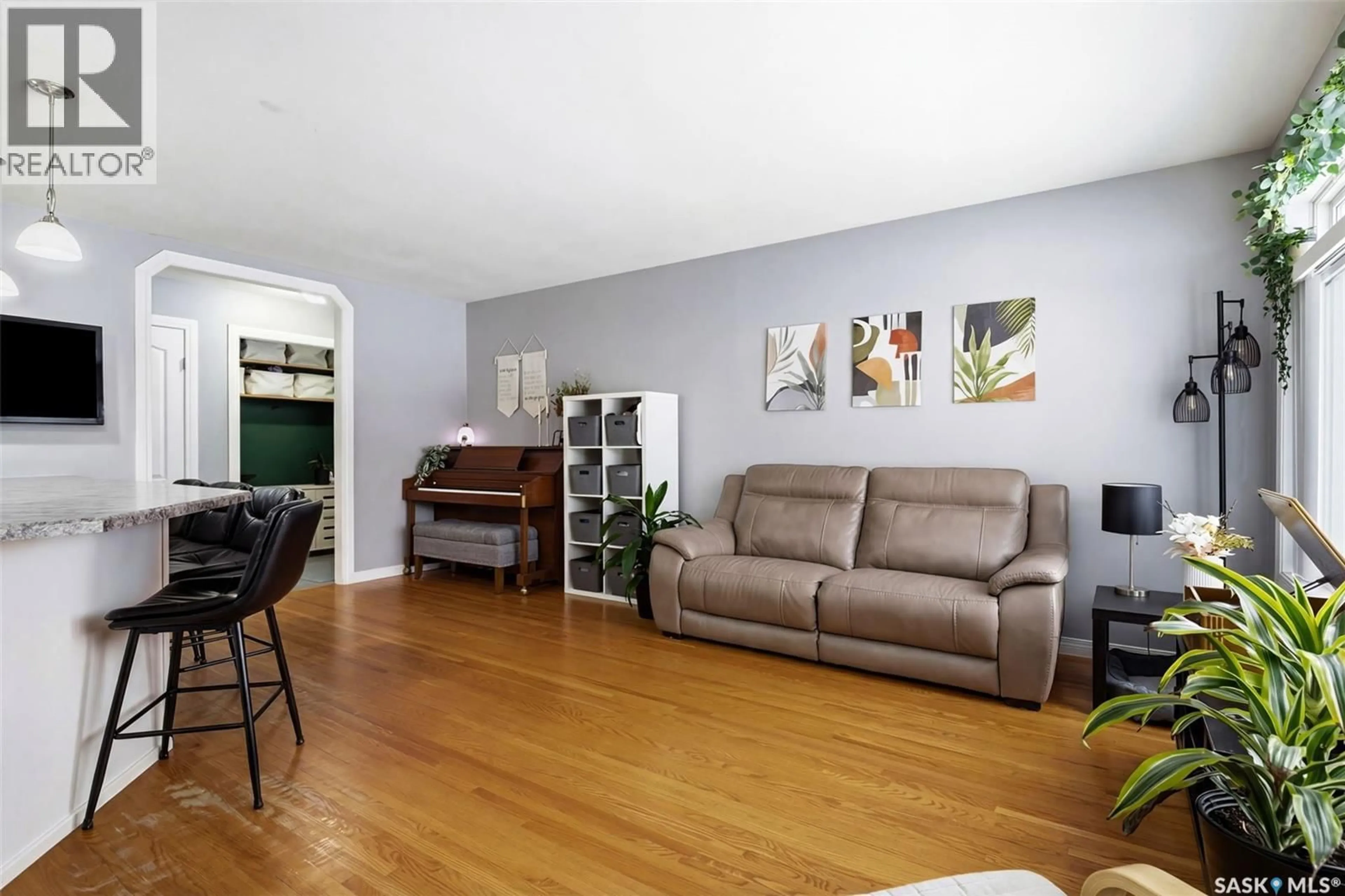 Living room with furniture, wood/laminate floor for 108 MATHESON CRESCENT, Regina Saskatchewan S4R5C4