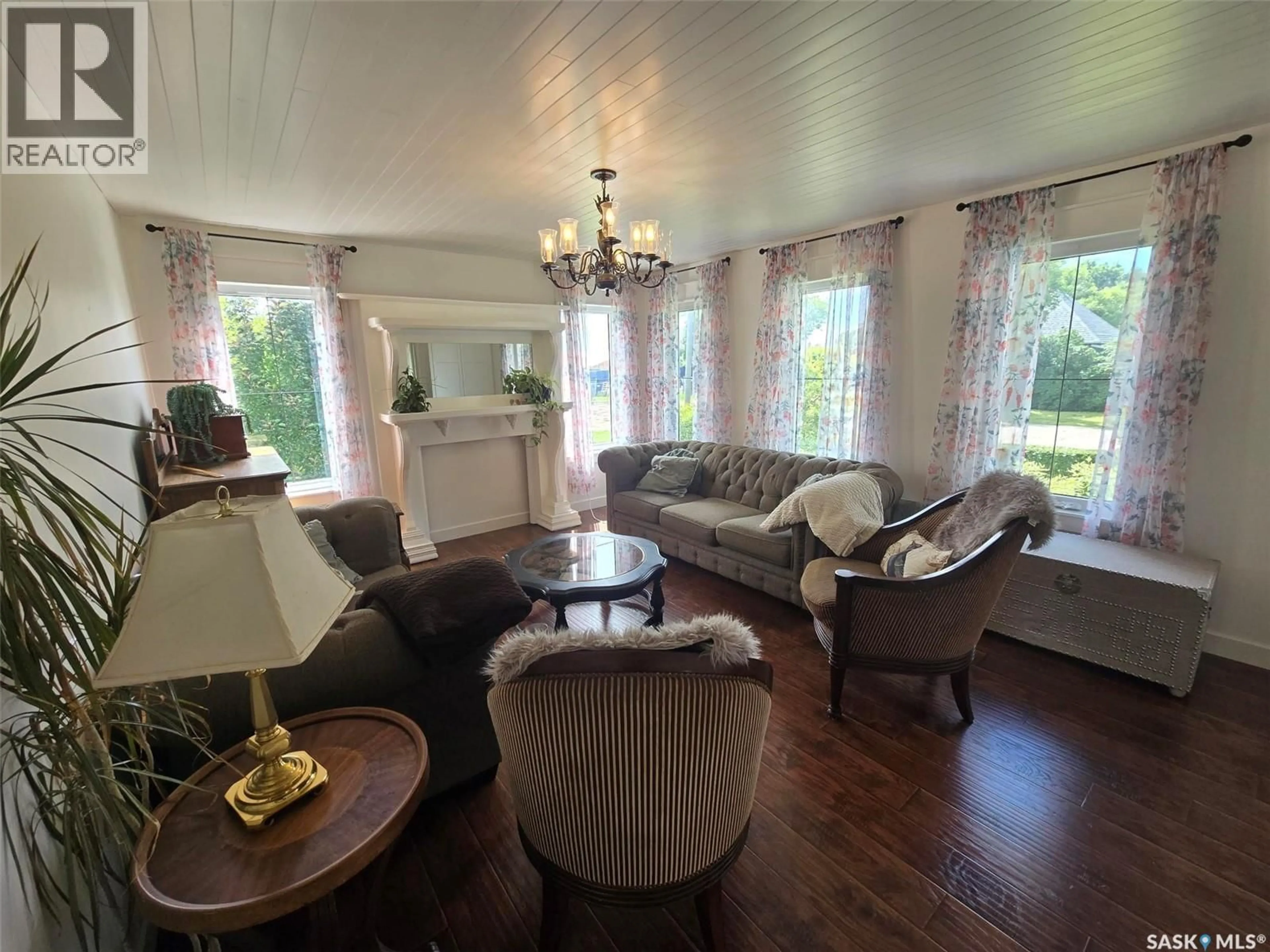 Living room with furniture, wood/laminate floor for 1306 ASSINIBOIA AVENUE, Grenfell Saskatchewan S0G2B0