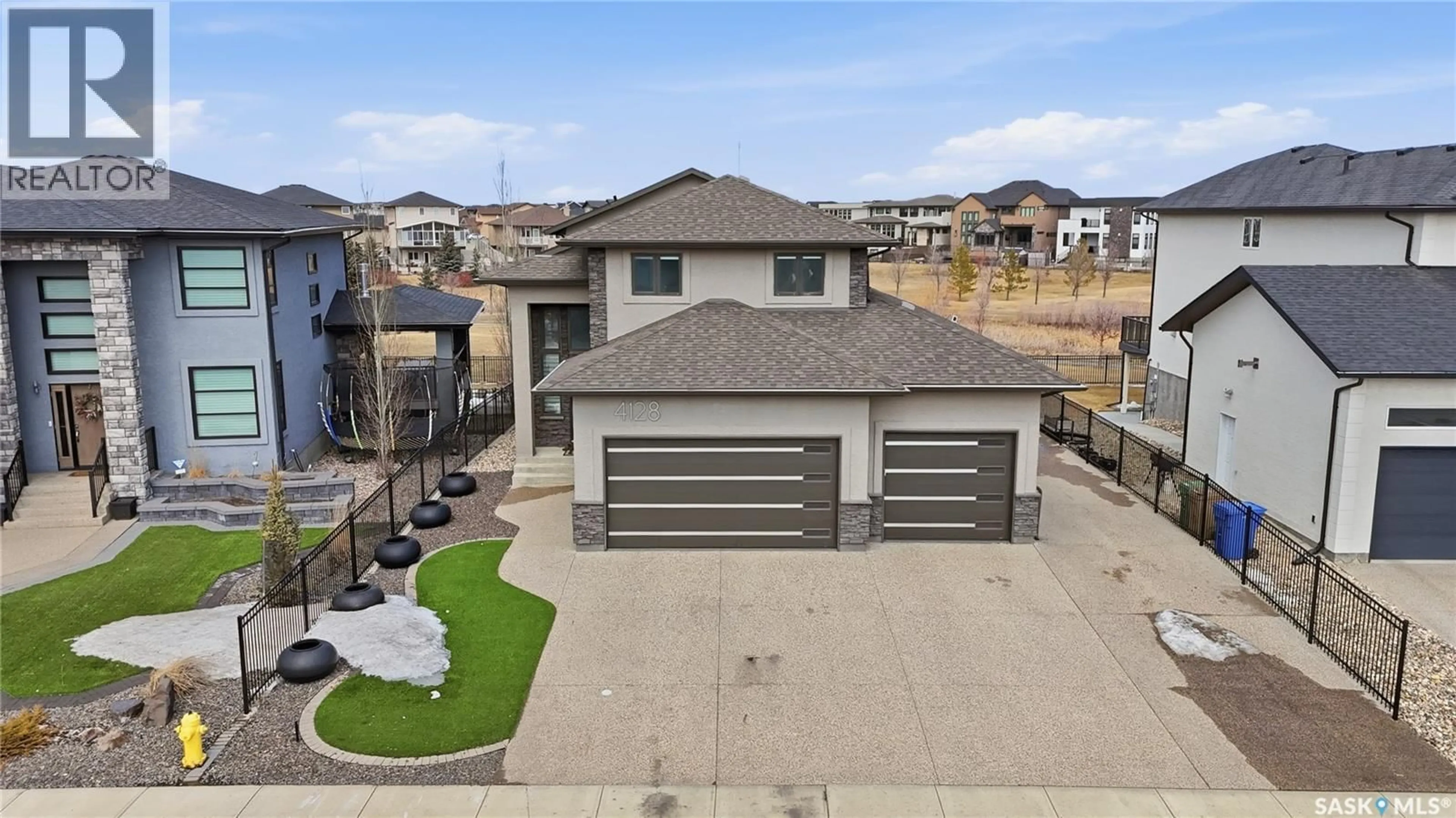 A pic from outside/outdoor area/front of a property/back of a property/a pic from drone, street for E - 4128 GREEN WILLOW TERRACE, Regina Saskatchewan S4V1M3