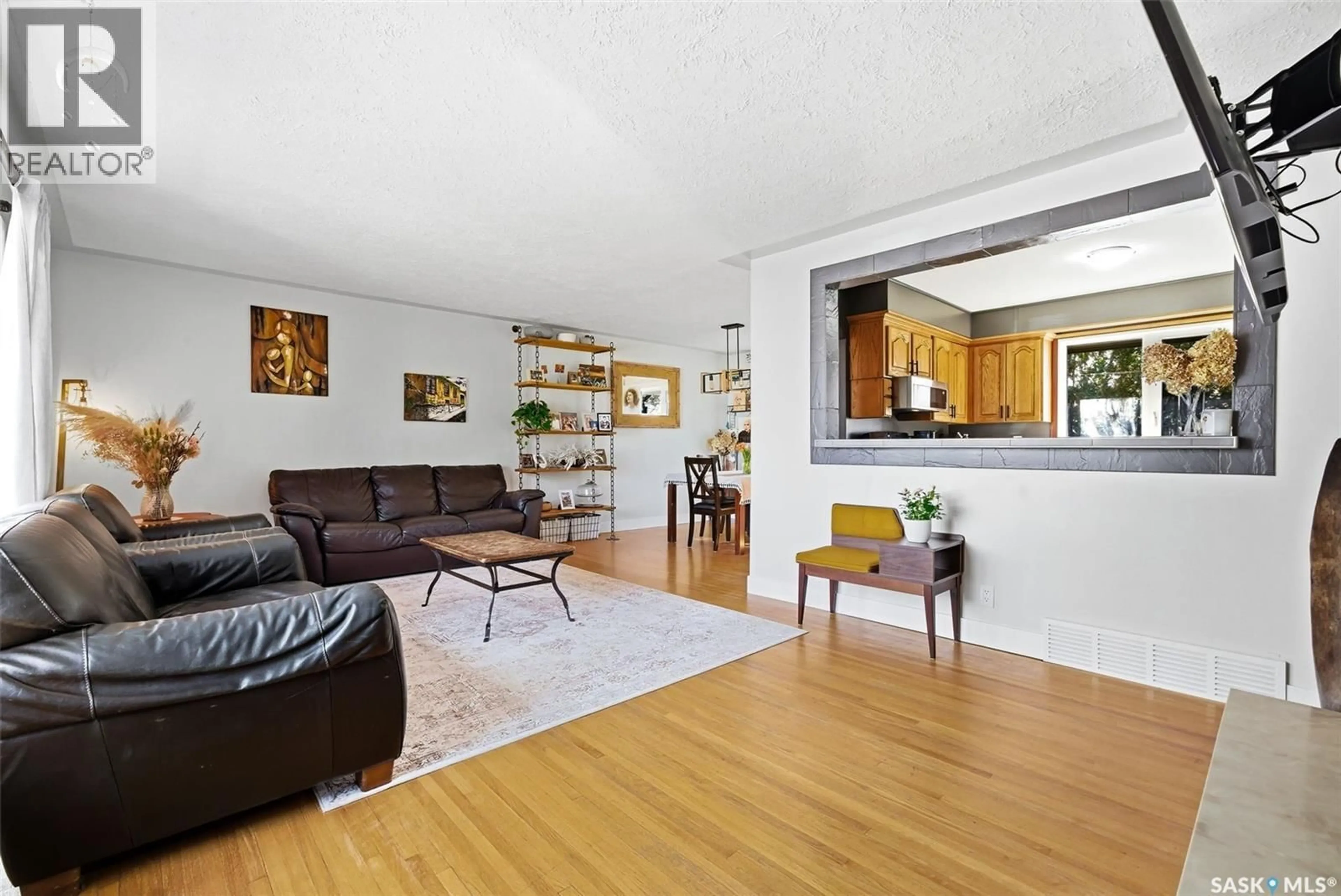 Living room with furniture, wood/laminate floor for 30 MARSH CRESCENT, Regina Saskatchewan S4S5R4