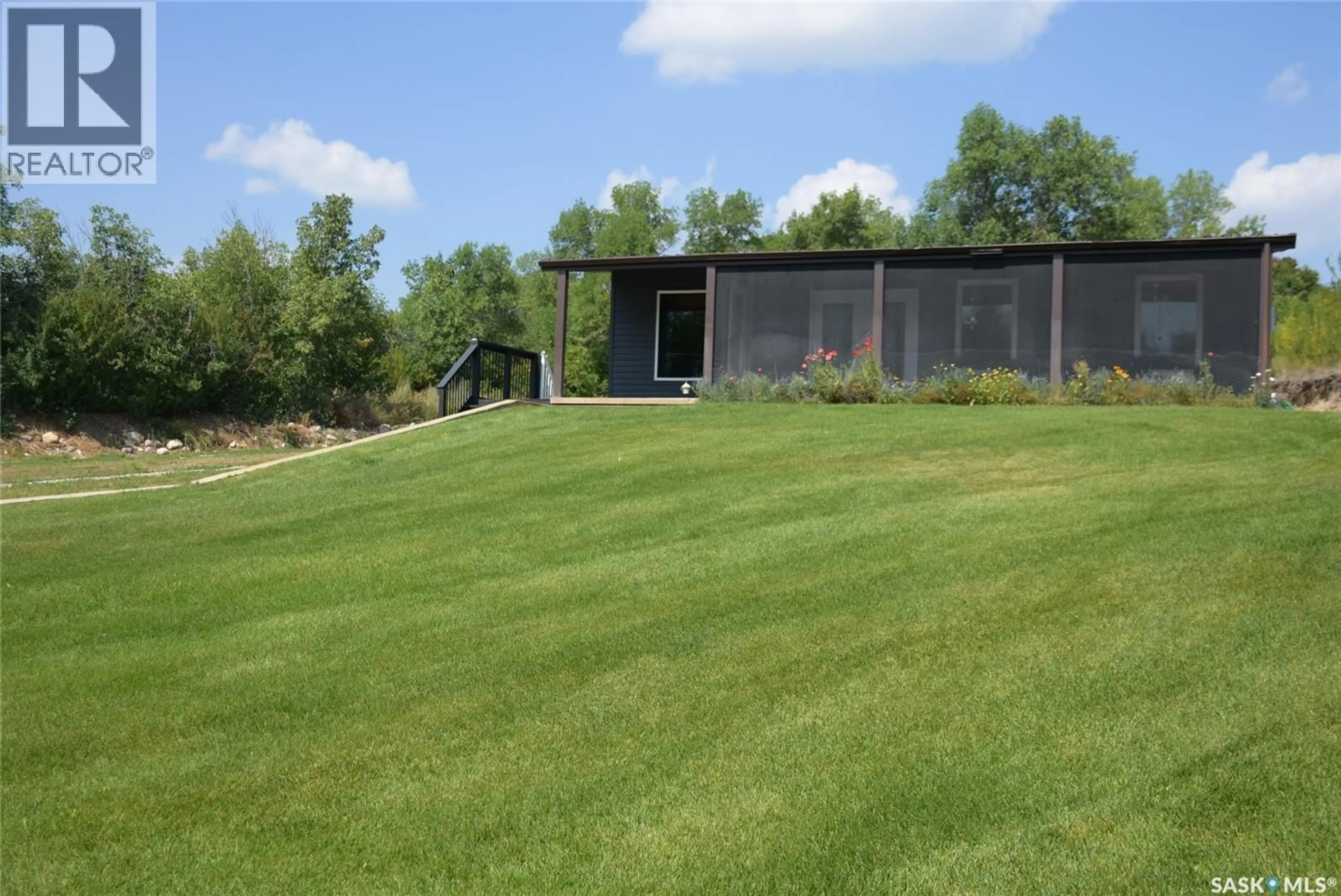 A pic from outside/outdoor area/front of a property/back of a property/a pic from drone, mountain view for 719 PASQUA LAKE ROAD, North Qu'Appelle Rm No. 187 Saskatchewan S0G1S0