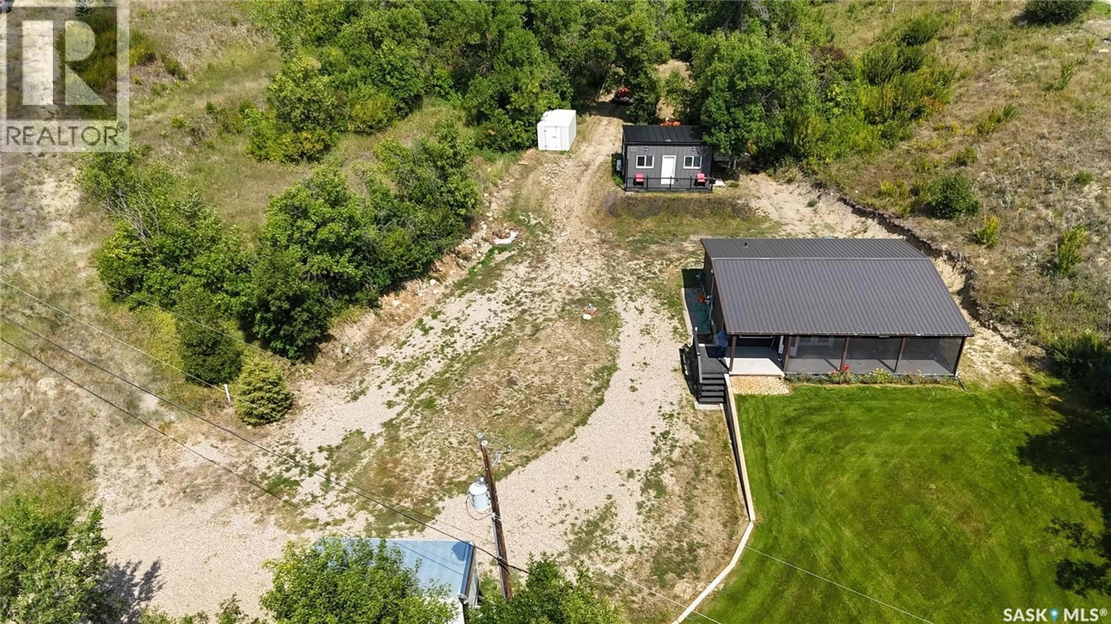 A pic from outside/outdoor area/front of a property/back of a property/a pic from drone, street for 719 PASQUA LAKE ROAD, North Qu'Appelle Rm No. 187 Saskatchewan S0G1S0
