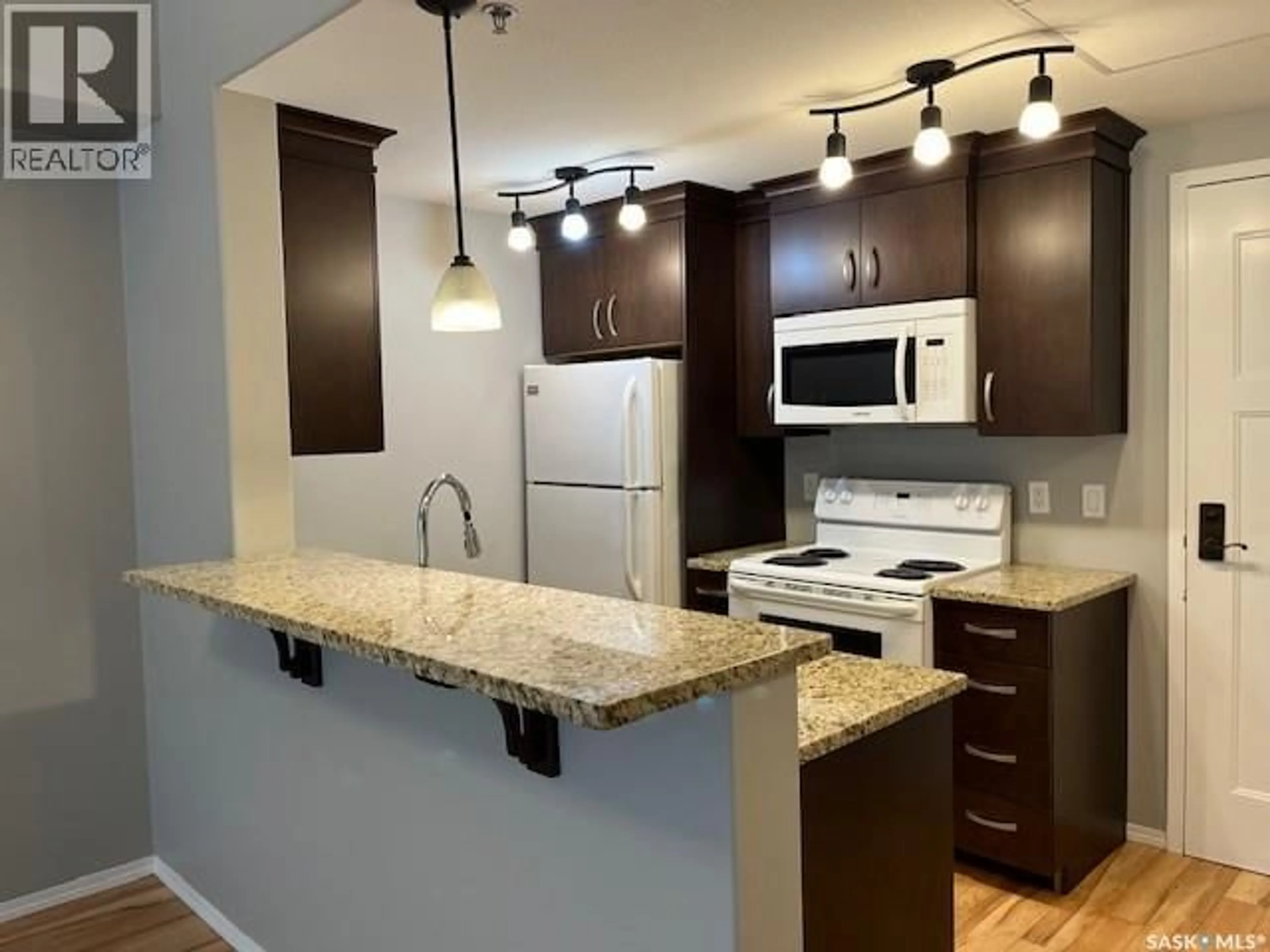 Standard kitchen, wood/laminate floor for 109 - 1220 BLACKFOOT DRIVE, Regina Saskatchewan S4S6T2