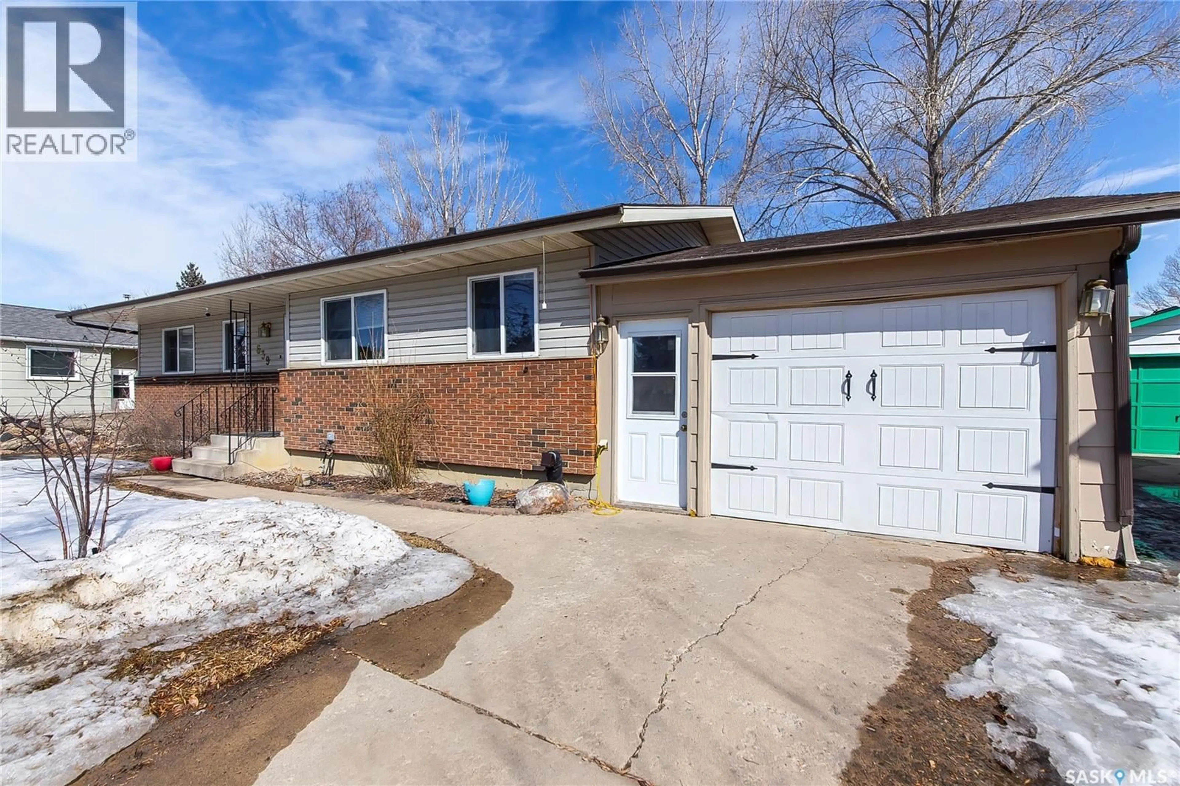 Home with brick exterior material, street for 639 REDBERRY ROAD, Saskatoon Saskatchewan S7K4S4