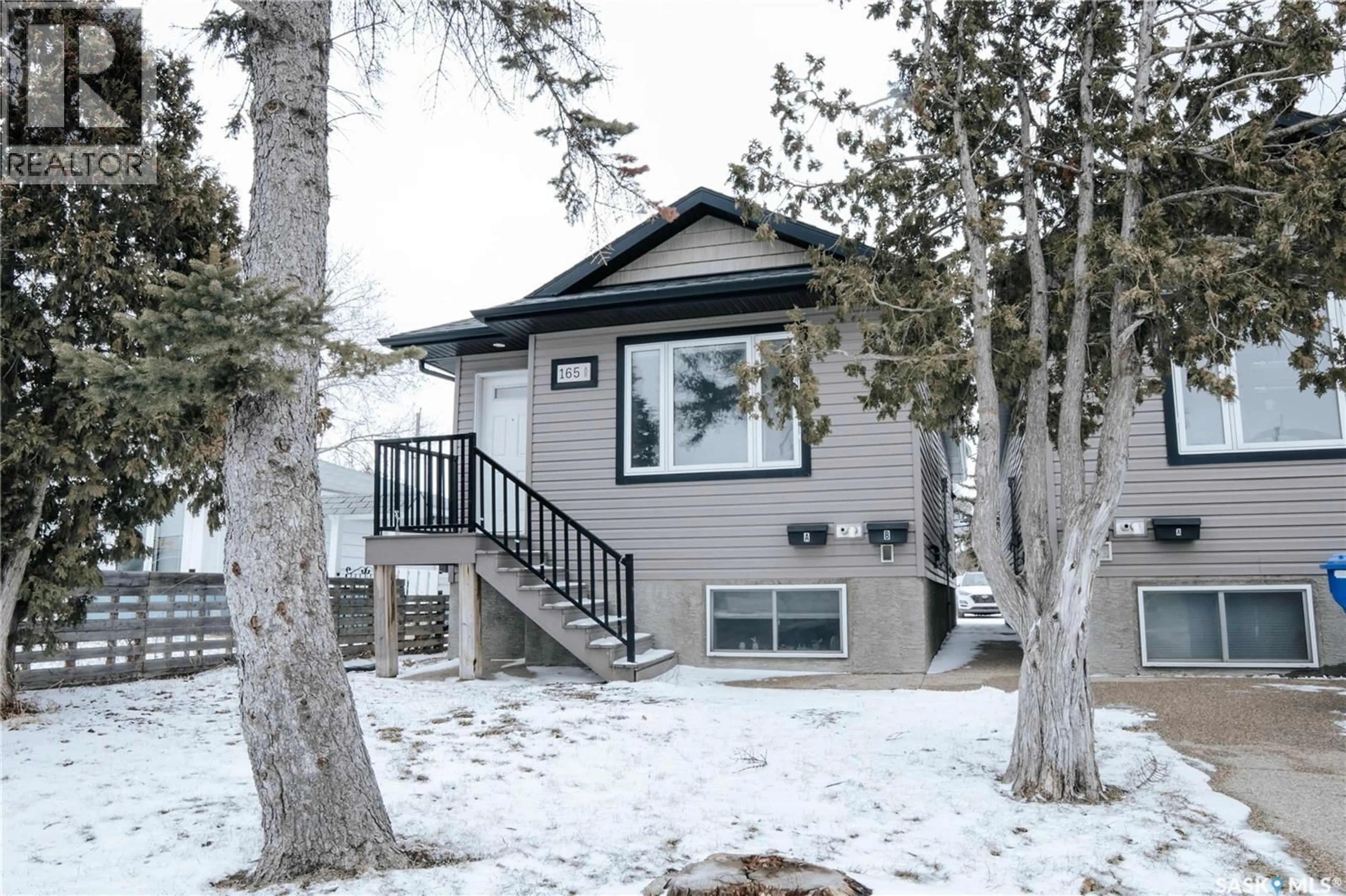 Home with vinyl exterior material, street for 165 MCINTYRE STREET, Regina Saskatchewan S4R3B6