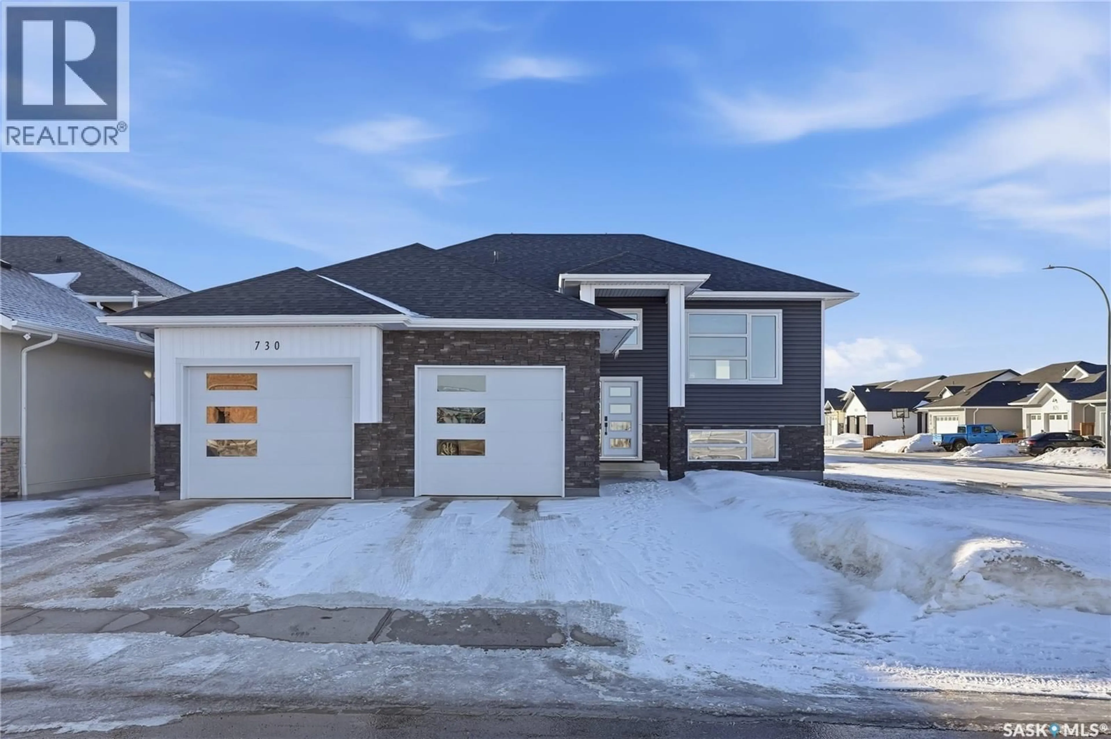 Home with brick exterior material, street for 818 BALLESTEROS CRESCENT, Warman Saskatchewan S0K4S3
