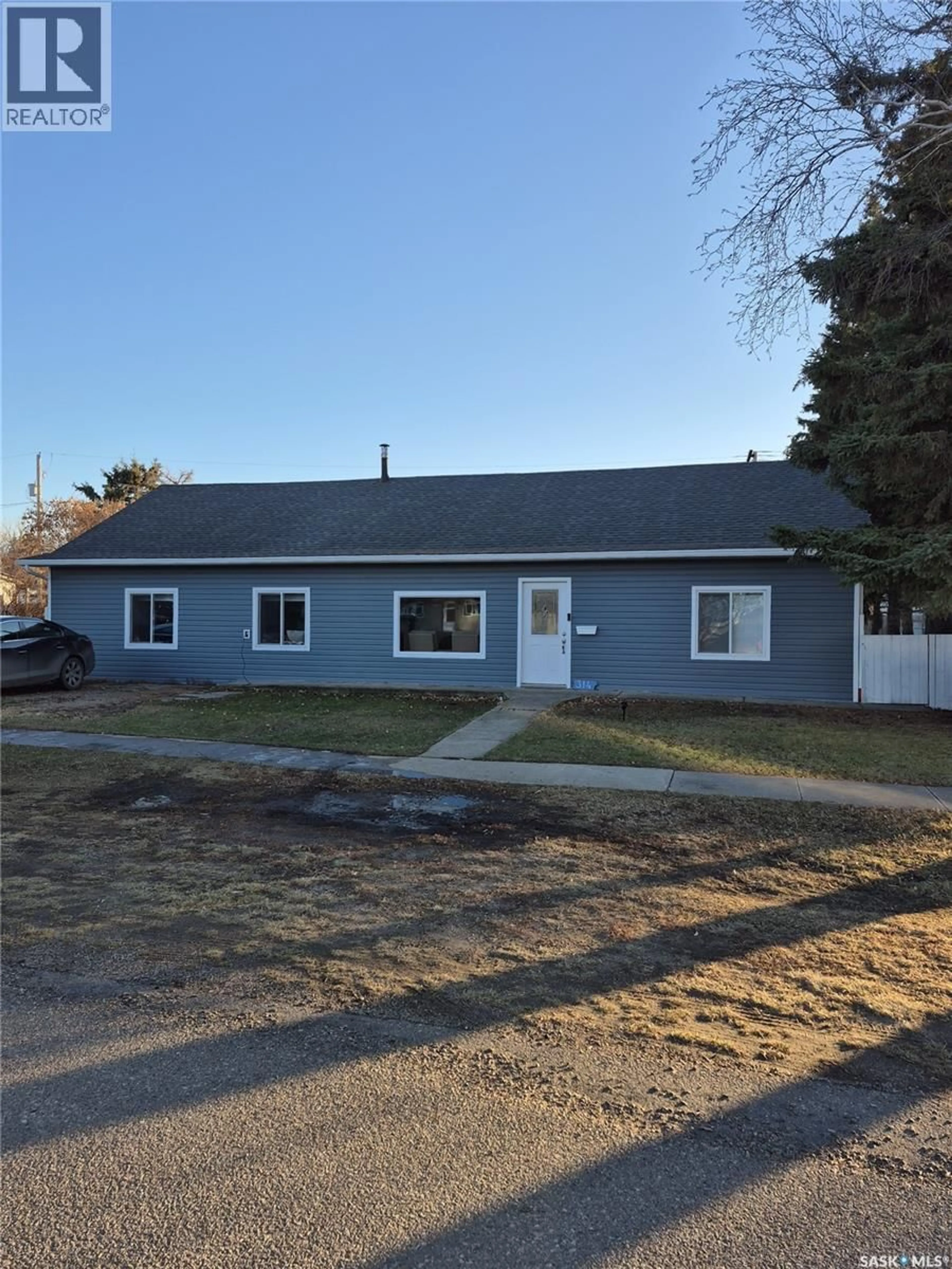 Home with vinyl exterior material, street for 314 MAIN STREET, Langham Saskatchewan S0K2L0