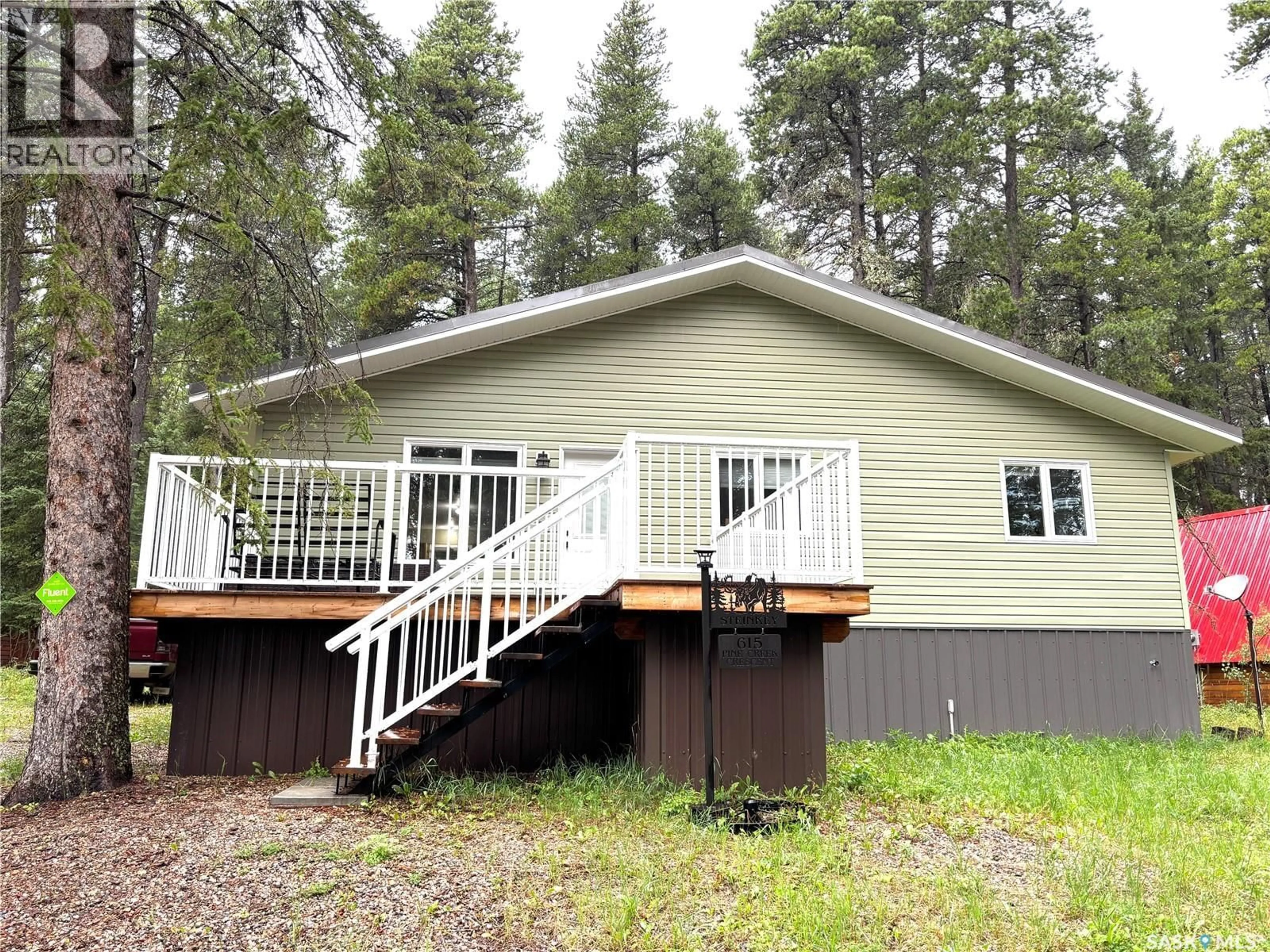 Home with vinyl exterior material, forest/trees view for 615 PINE CREEK CRESCENT, Cypress Hills Provincial Park Saskatchewan S0N1N0