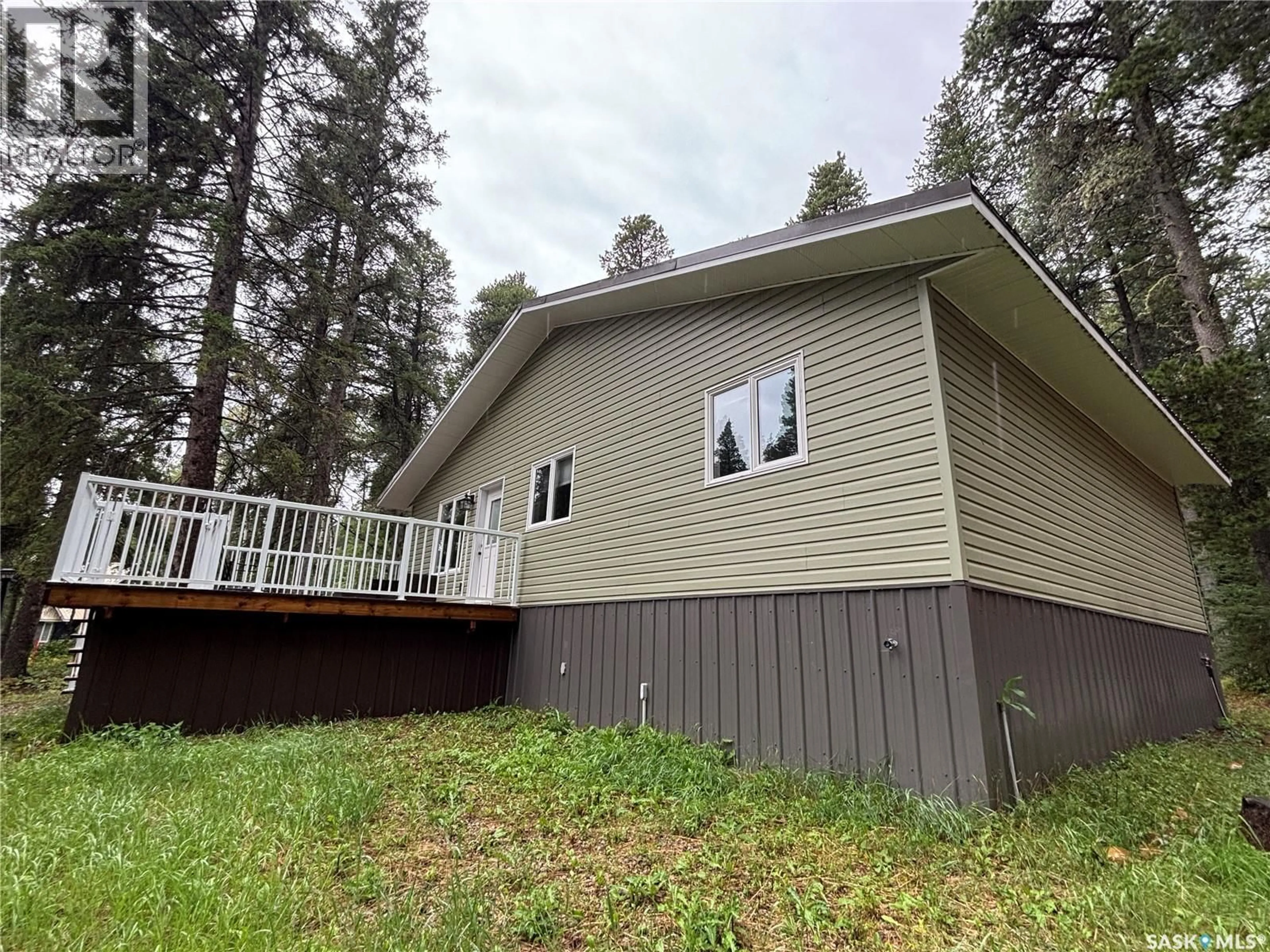 Home with vinyl exterior material, forest/trees view for 615 PINE CREEK CRESCENT, Cypress Hills Provincial Park Saskatchewan S0N1N0