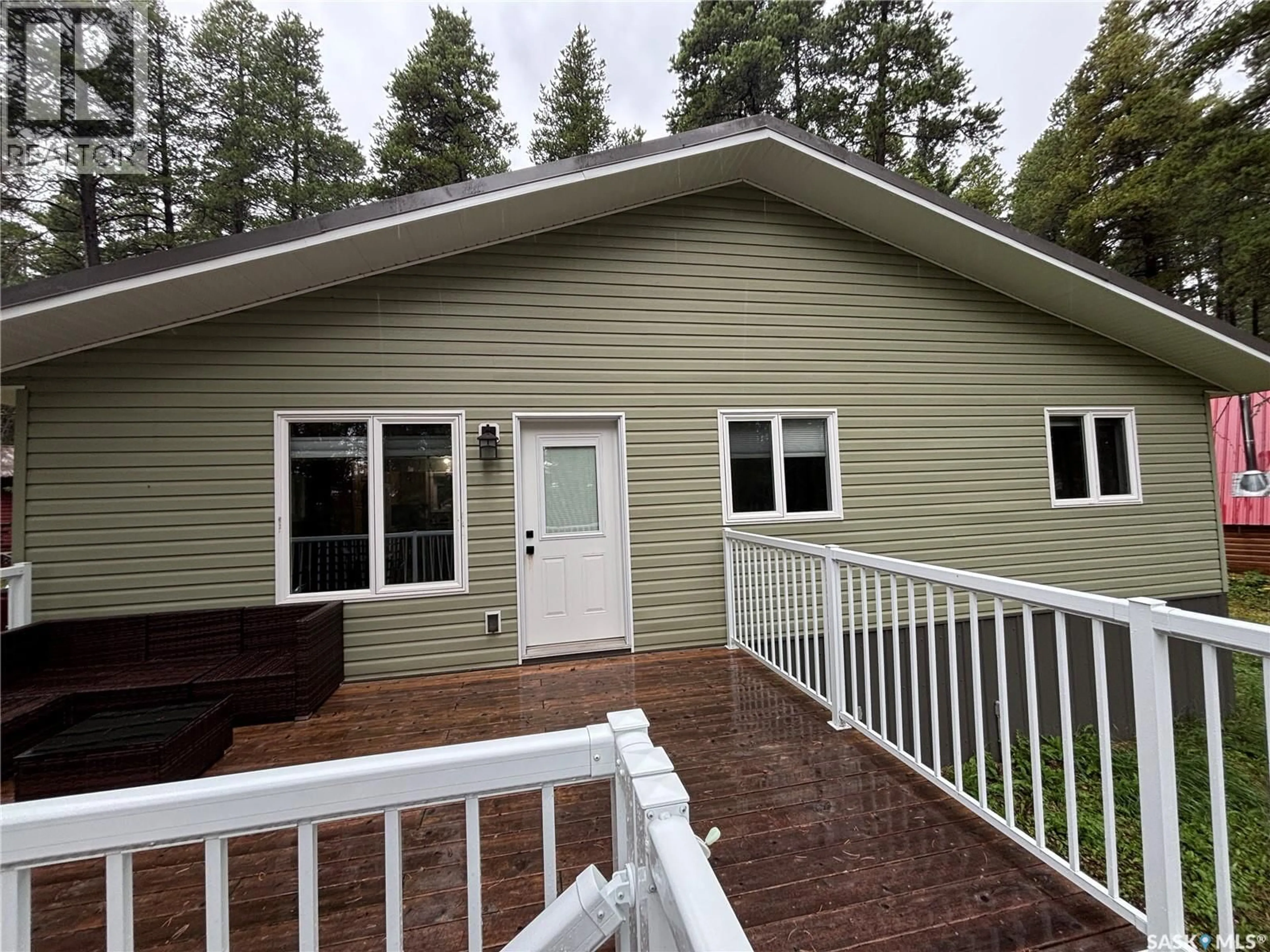 Home with vinyl exterior material, forest/trees view for 615 PINE CREEK CRESCENT, Cypress Hills Provincial Park Saskatchewan S0N1N0