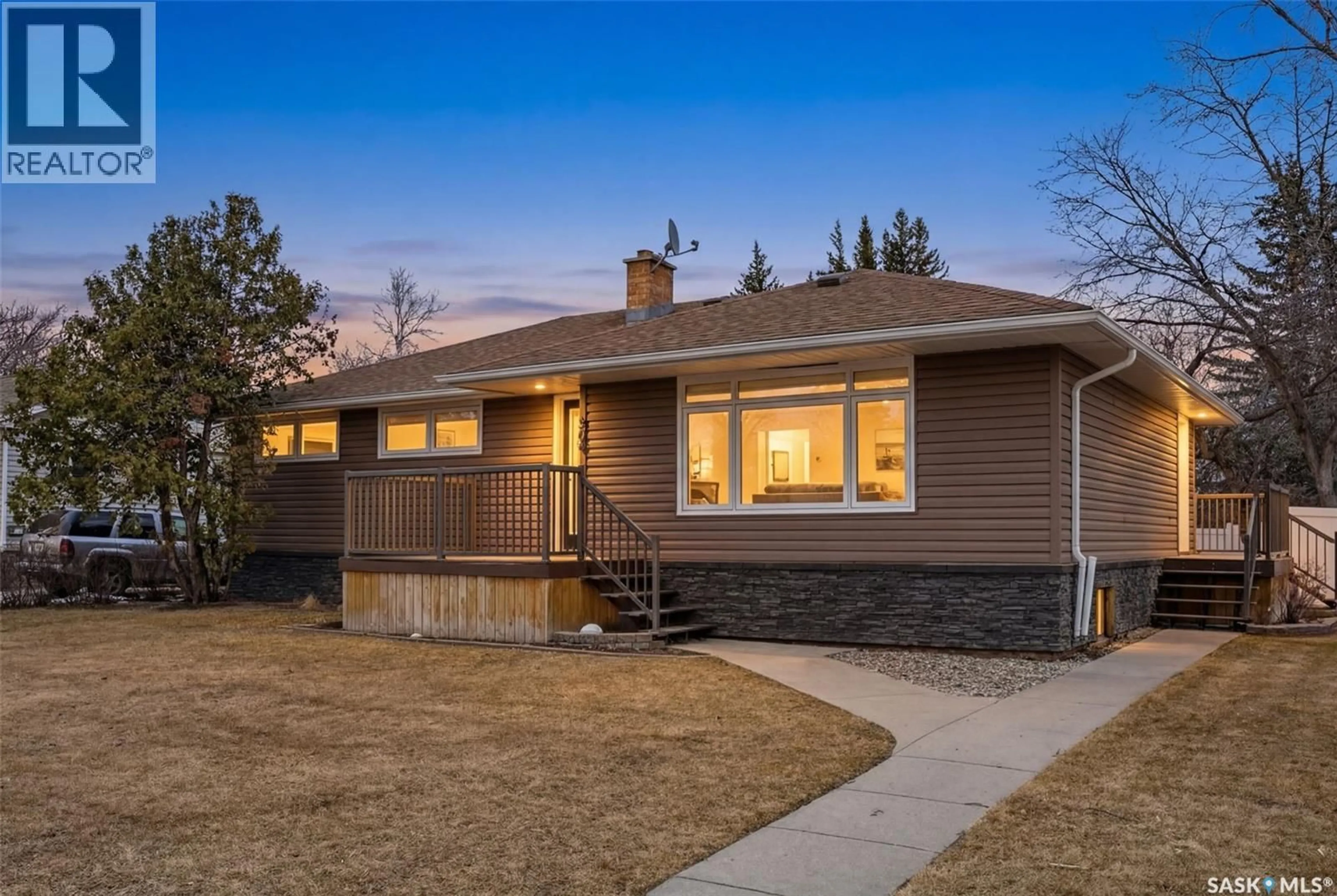 Home with vinyl exterior material, street for 504 11TH STREET, Weyburn Saskatchewan S4H1J9