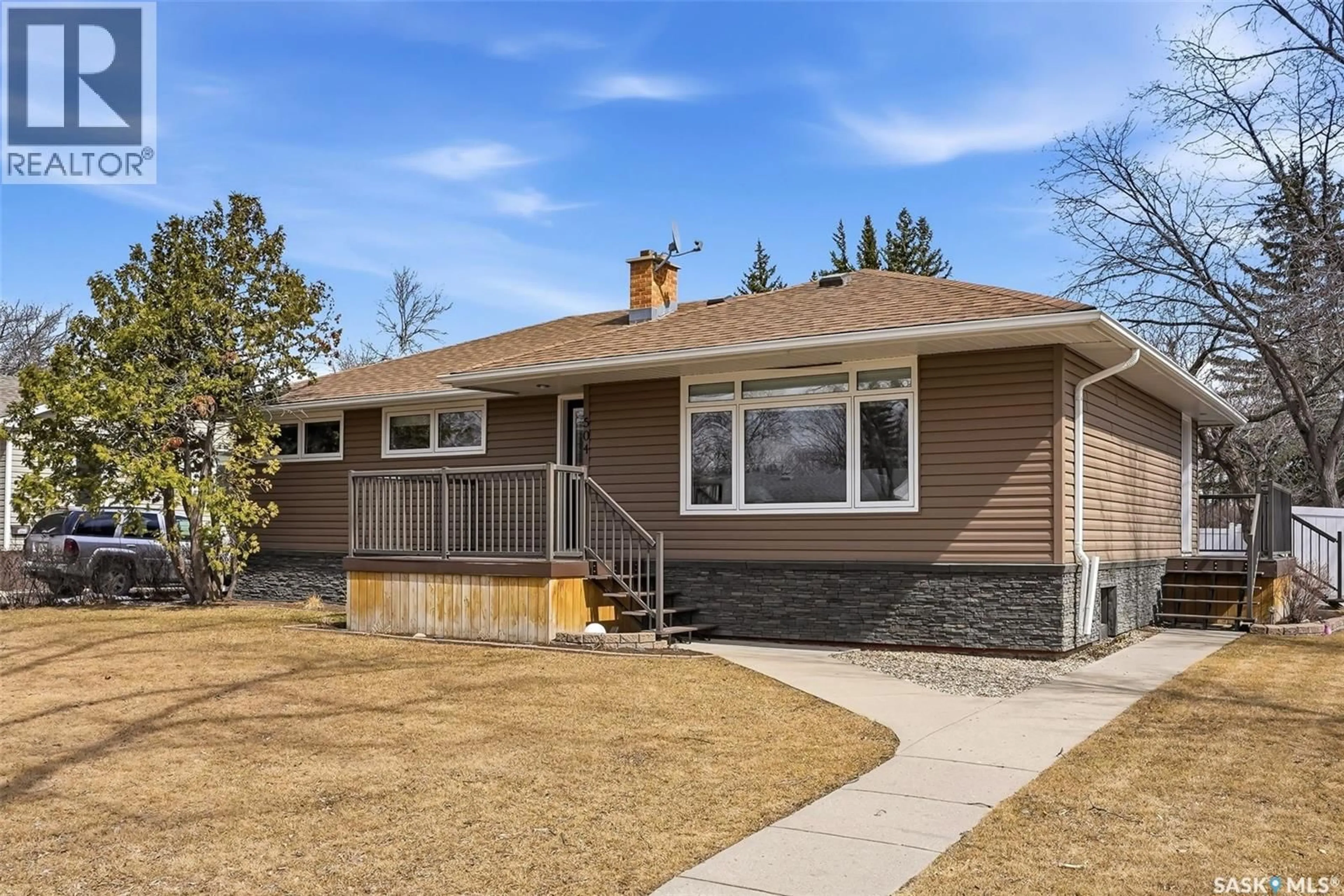 Home with vinyl exterior material, street for 504 11TH STREET, Weyburn Saskatchewan S4H1J9