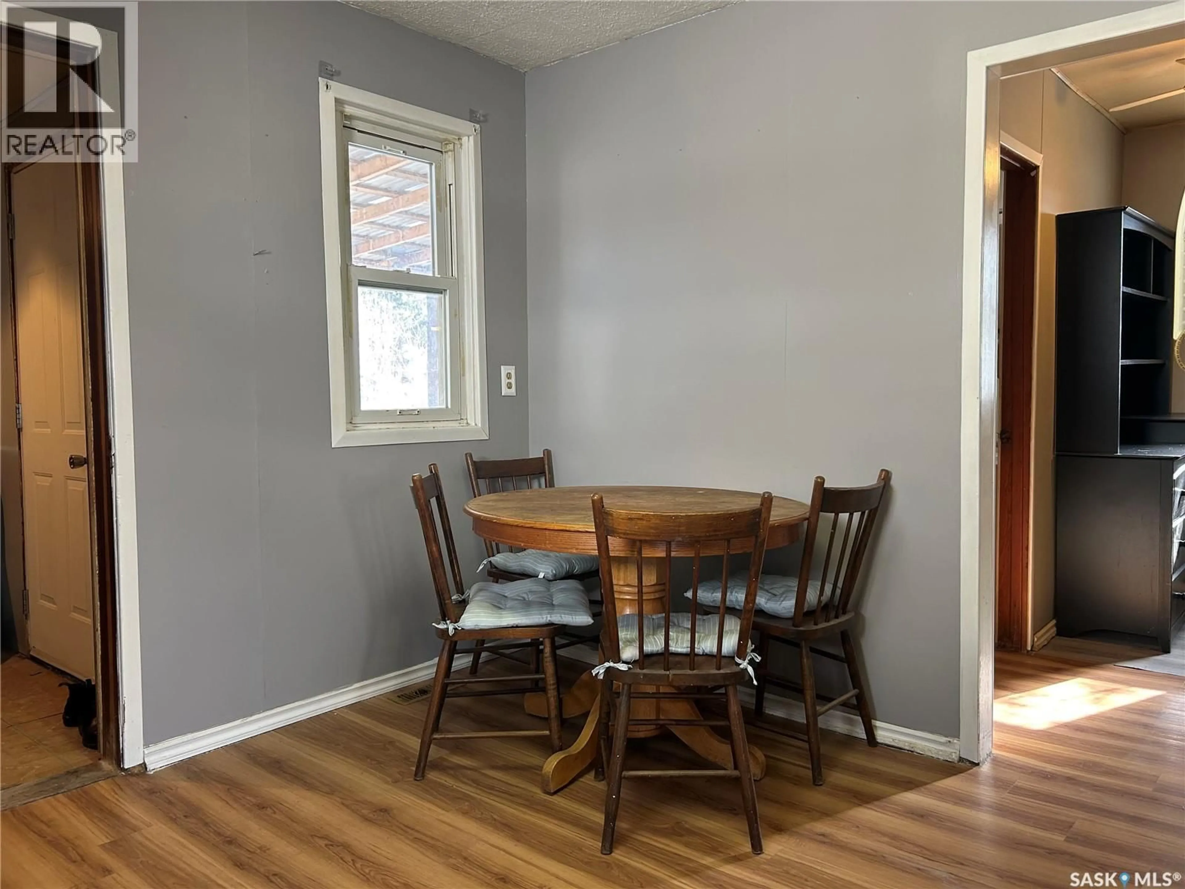 Dining room, wood/laminate floor for 512 RAILWAY AVENUE, Lampman Saskatchewan S0C1N0