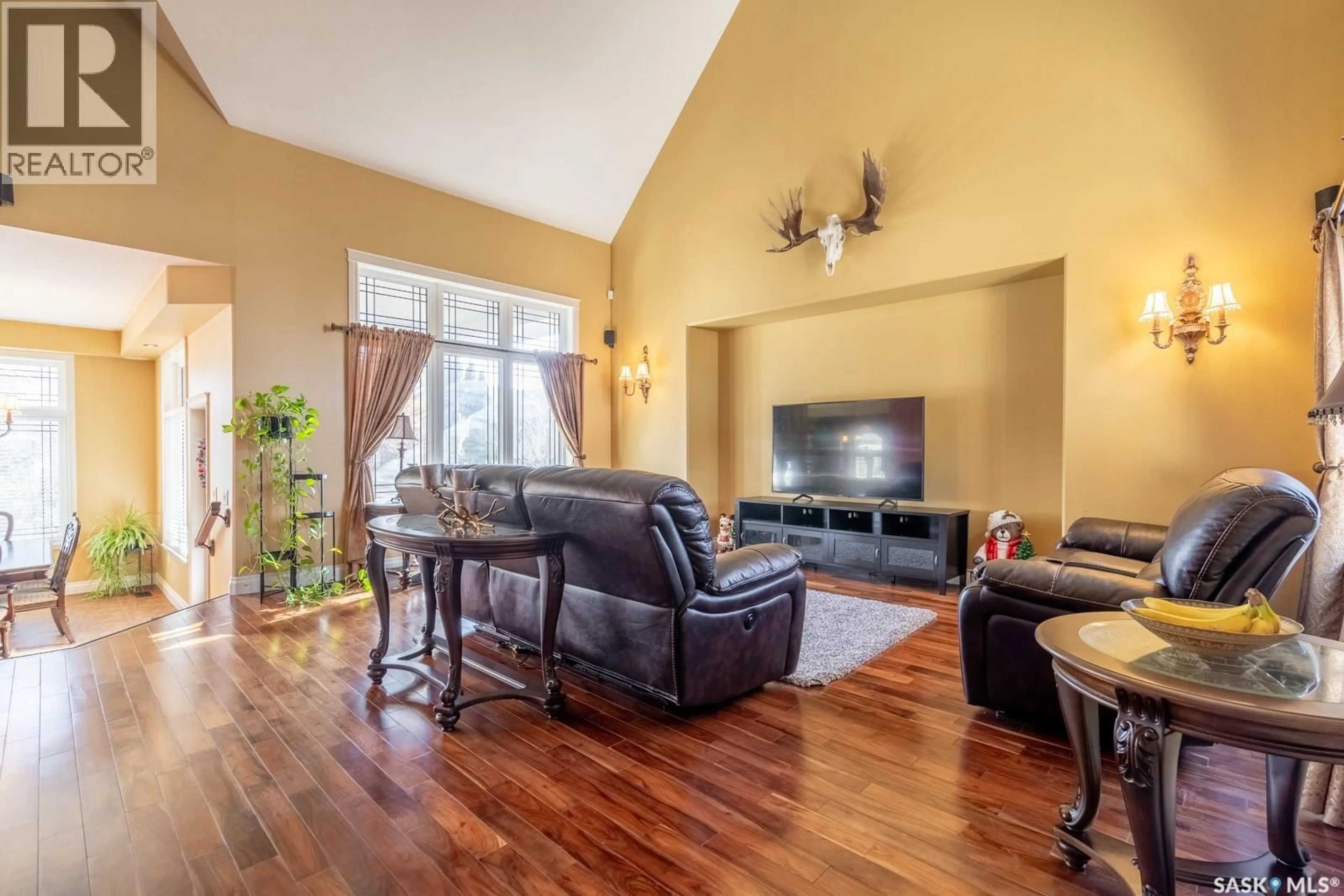 Living room with furniture, wood/laminate floor for 2514 BRODERICK ROAD, Regina Saskatchewan S4V1K6