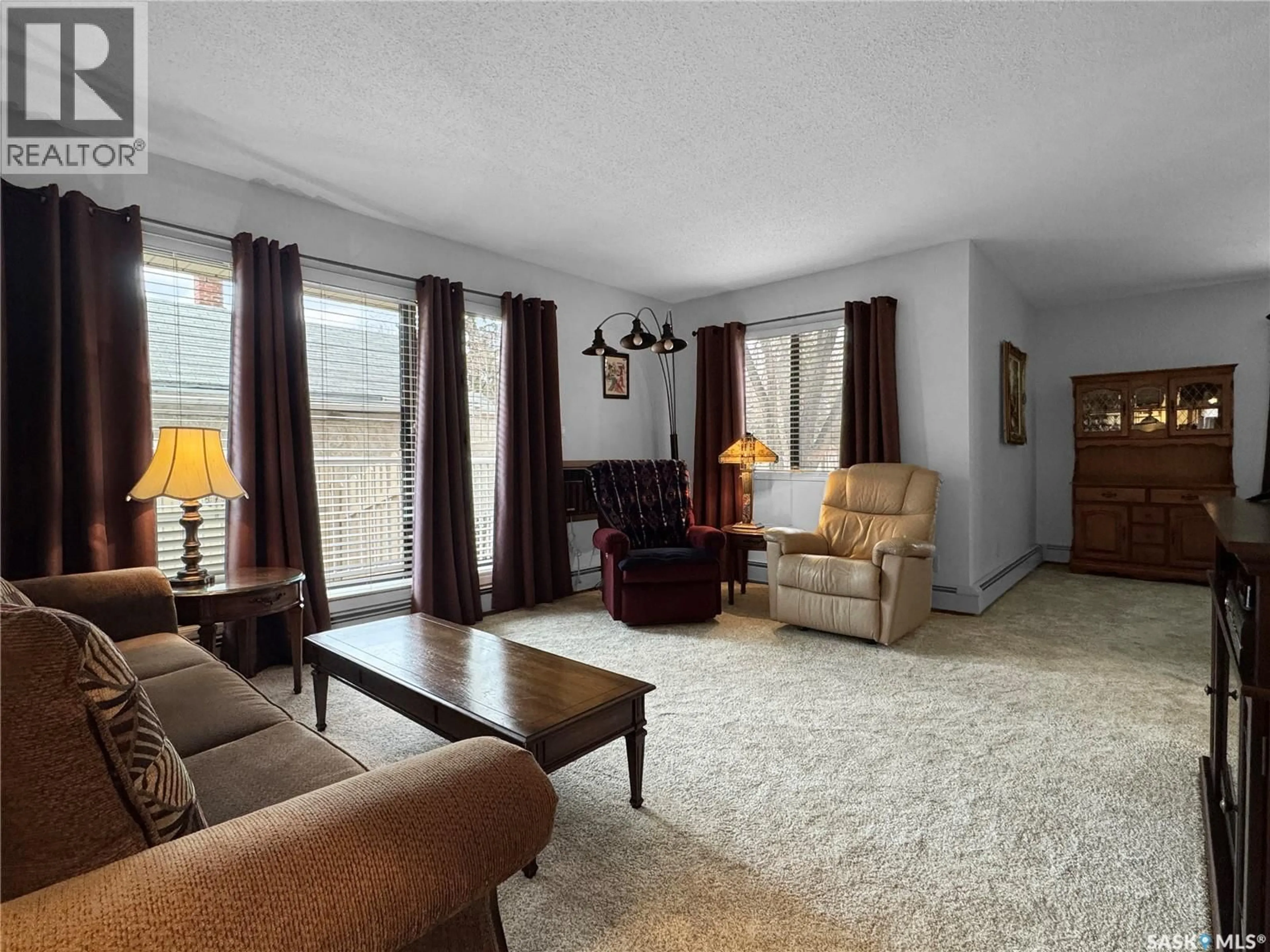 Living room with furniture, unknown for 110 - 1452 102ND STREET, North Battleford Saskatchewan S9A1G7