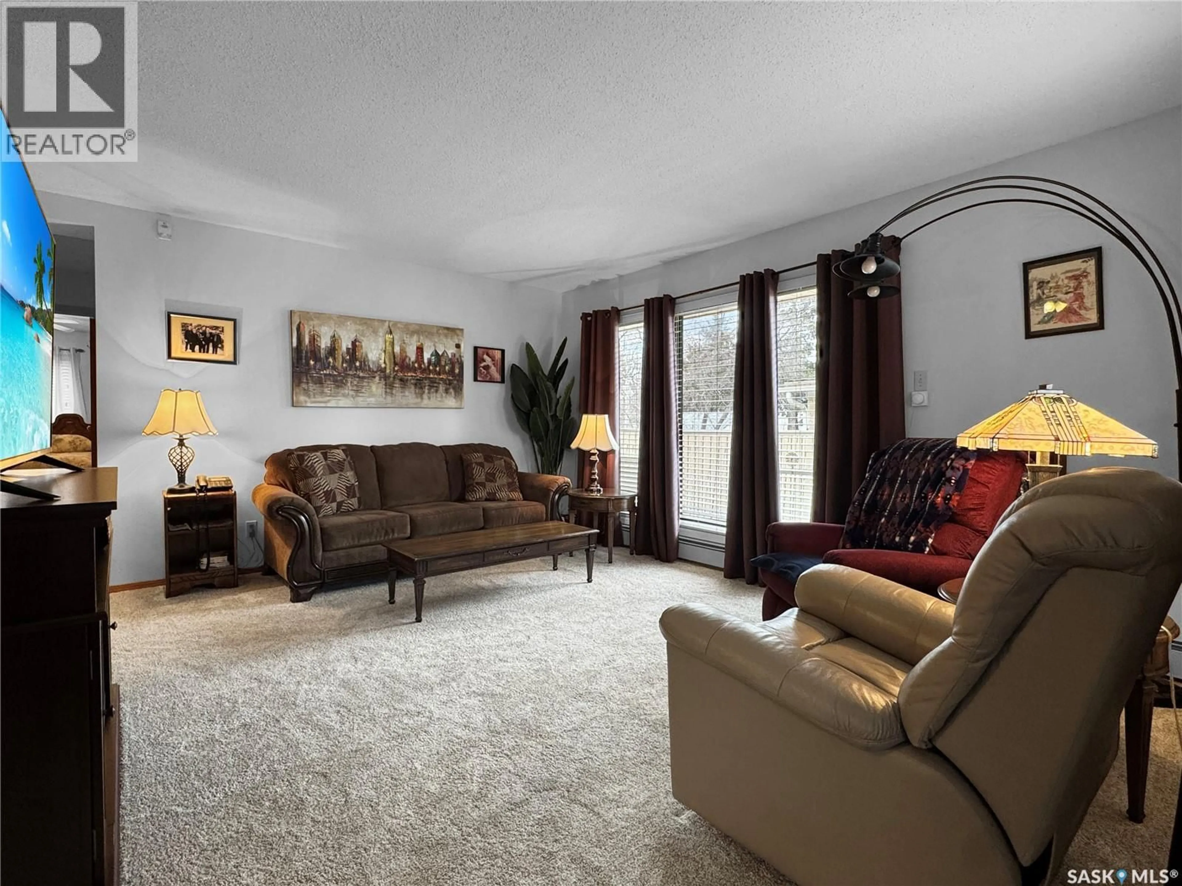 Living room with furniture, carpet floor for 110 - 1452 102ND STREET, North Battleford Saskatchewan S9A1G7
