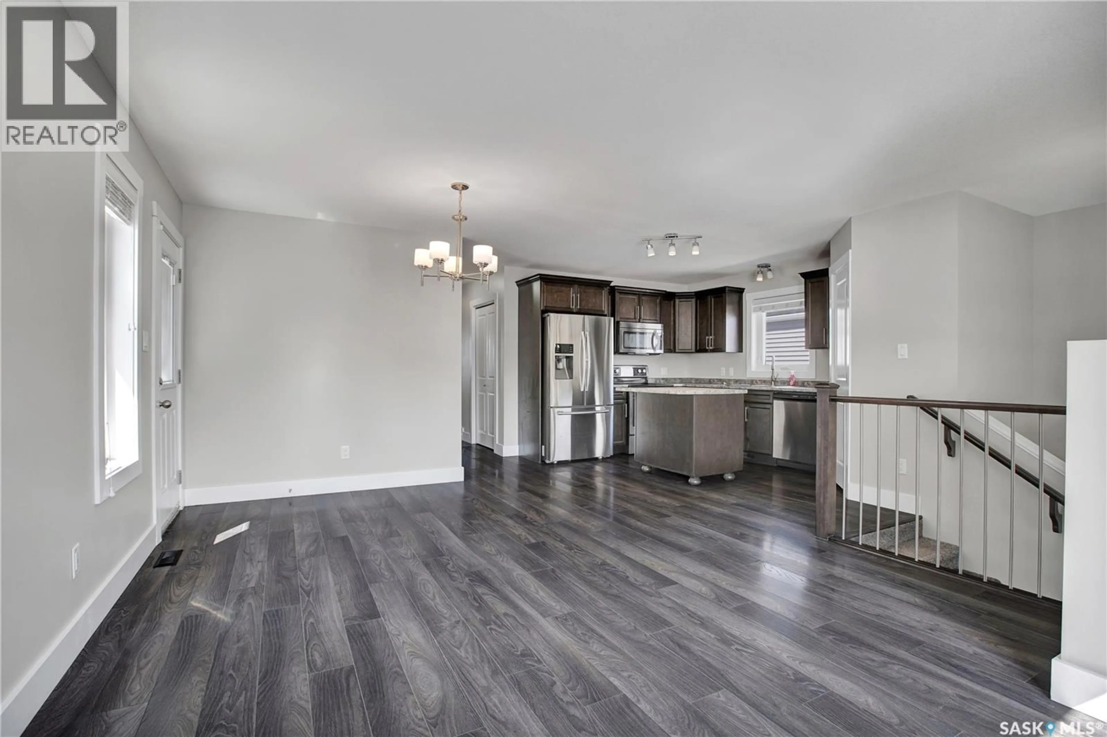 Open concept kitchen, wood/laminate floor for 315 ROSEWOOD BOULEVARD, Saskatoon Saskatchewan S7V0G8