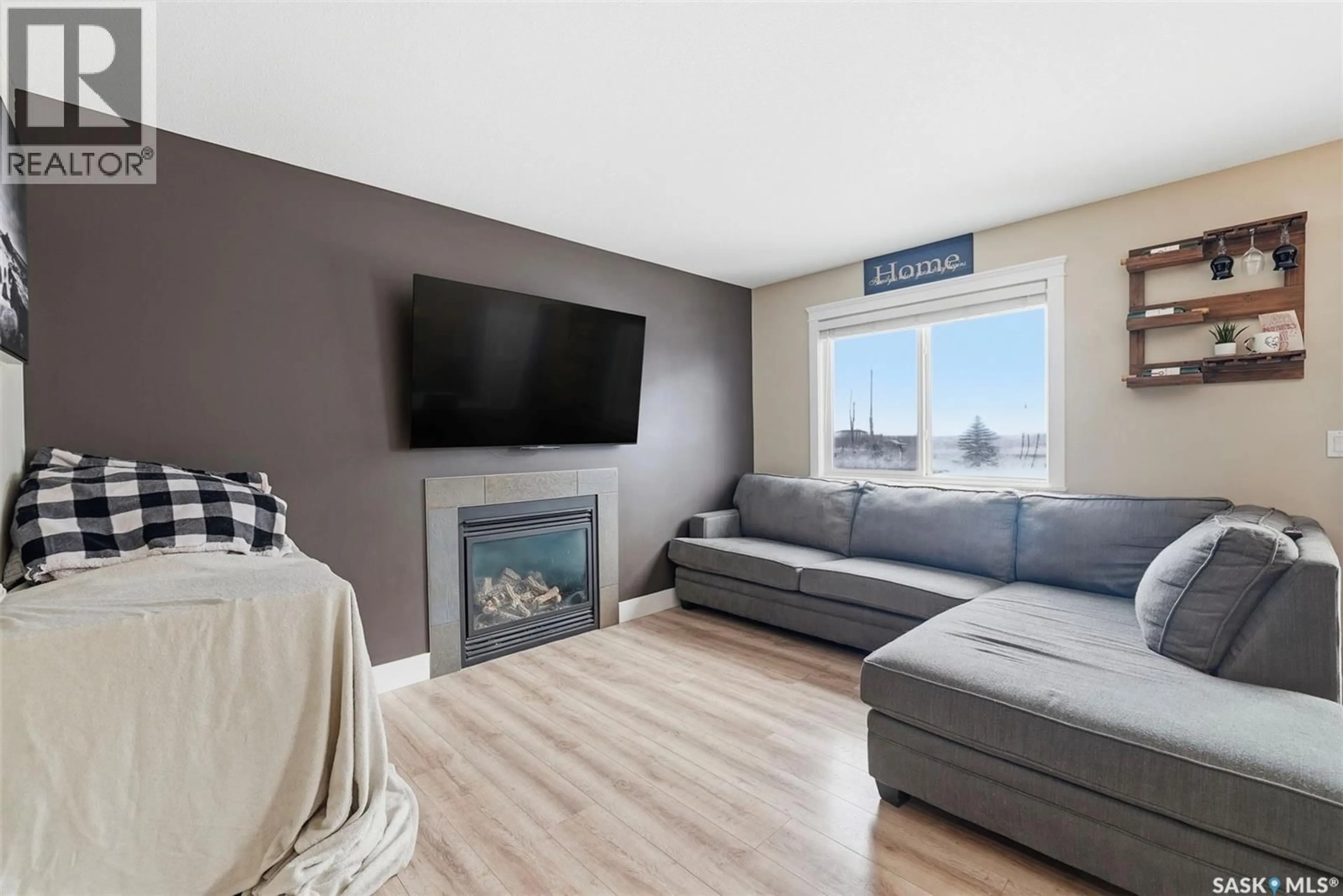 Living room with furniture, wood/laminate floor for S - 133 901 4TH STREET, Martensville Saskatchewan S0K2S1