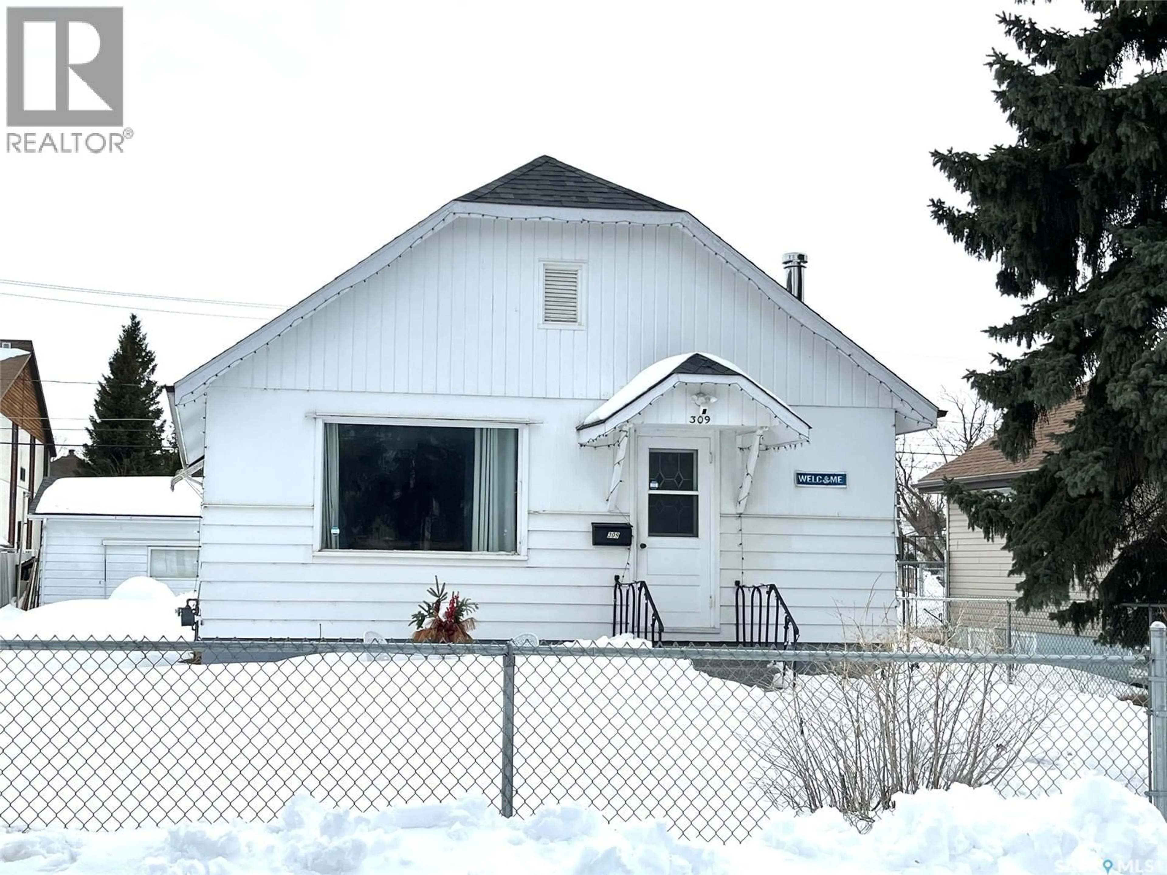 Home with vinyl exterior material, street for 309 10TH STREET, Prince Albert Saskatchewan S6V0Z3