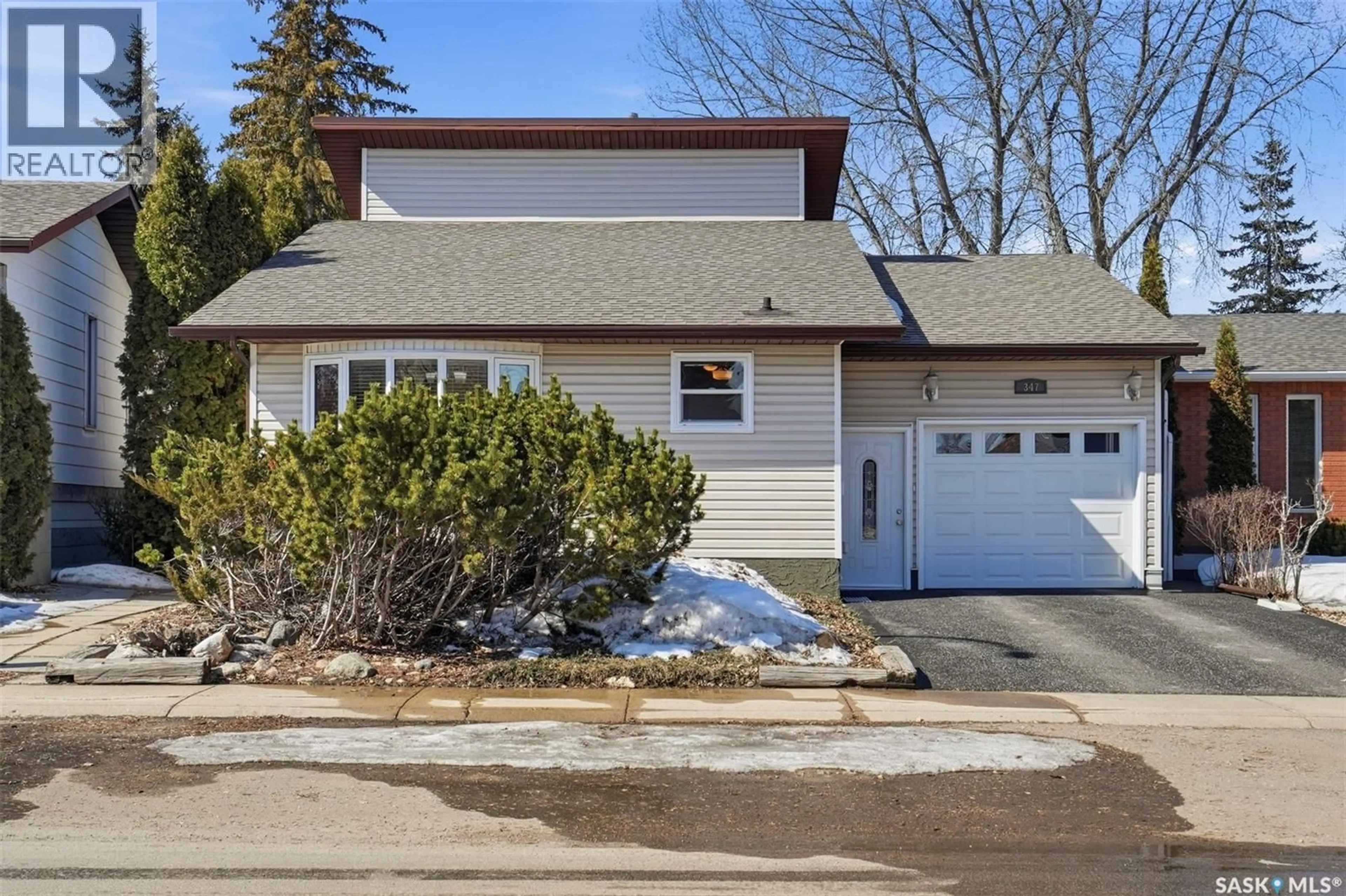 Home with vinyl exterior material, street for 347 DELARONDE ROAD, Saskatoon Saskatchewan S7J3Y5