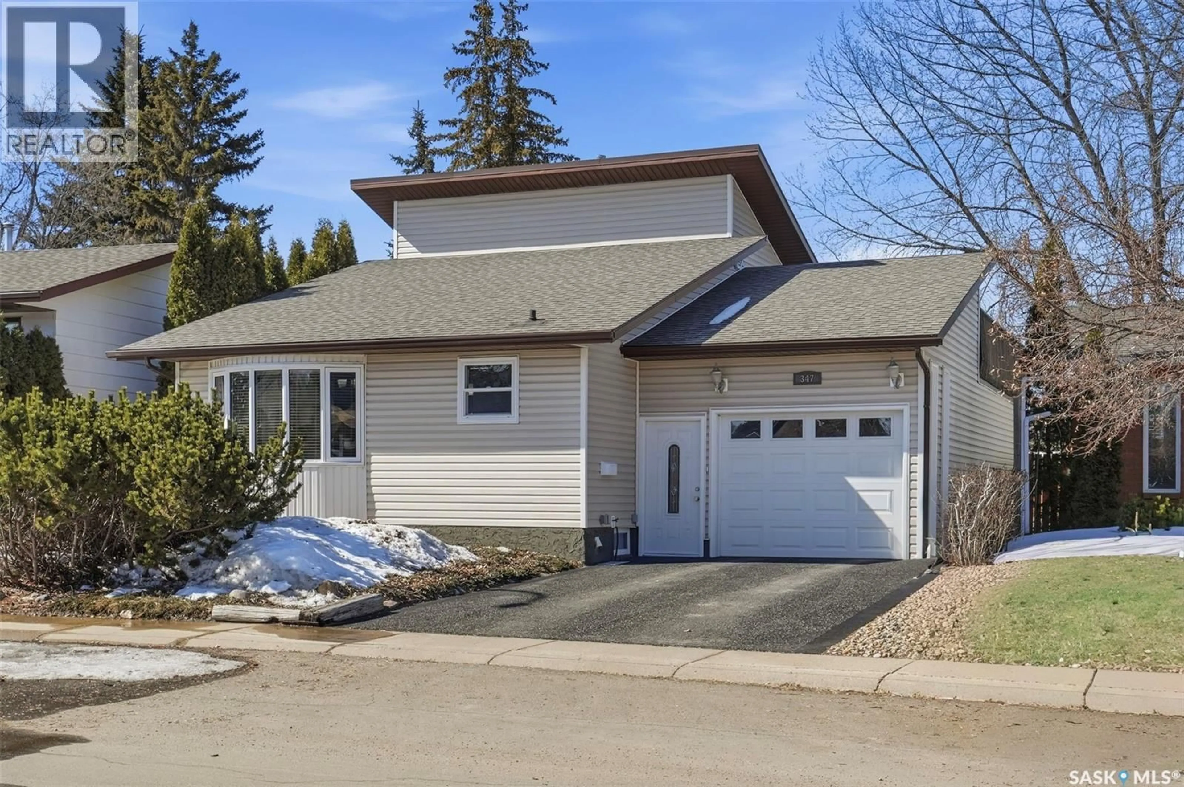 Home with vinyl exterior material, street for 347 DELARONDE ROAD, Saskatoon Saskatchewan S7J3Y5