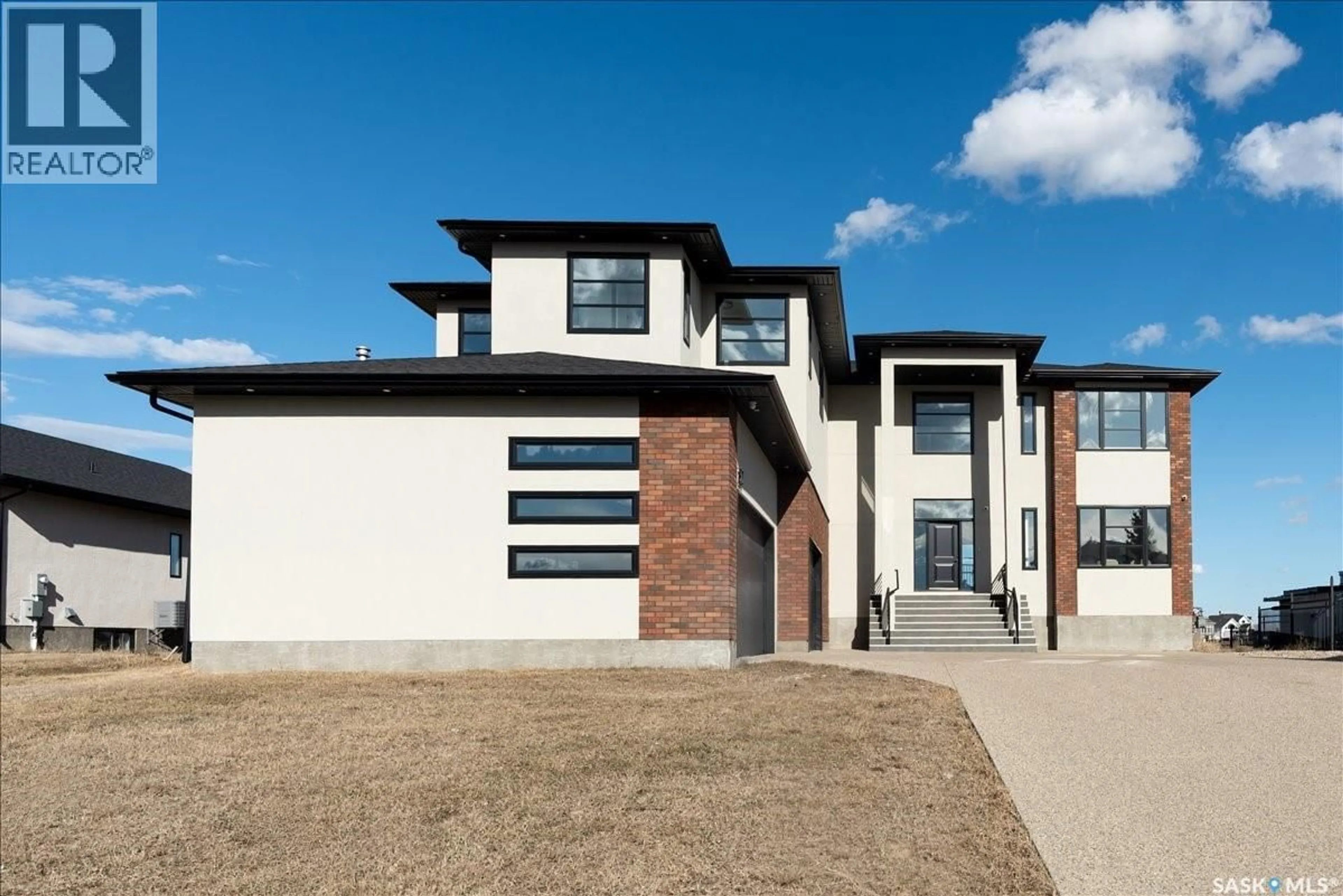 Home with brick exterior material, street for 304 SPRUCE CREEK CRESCENT, Edenwold Rm No.158 Saskatchewan S0G3Z0
