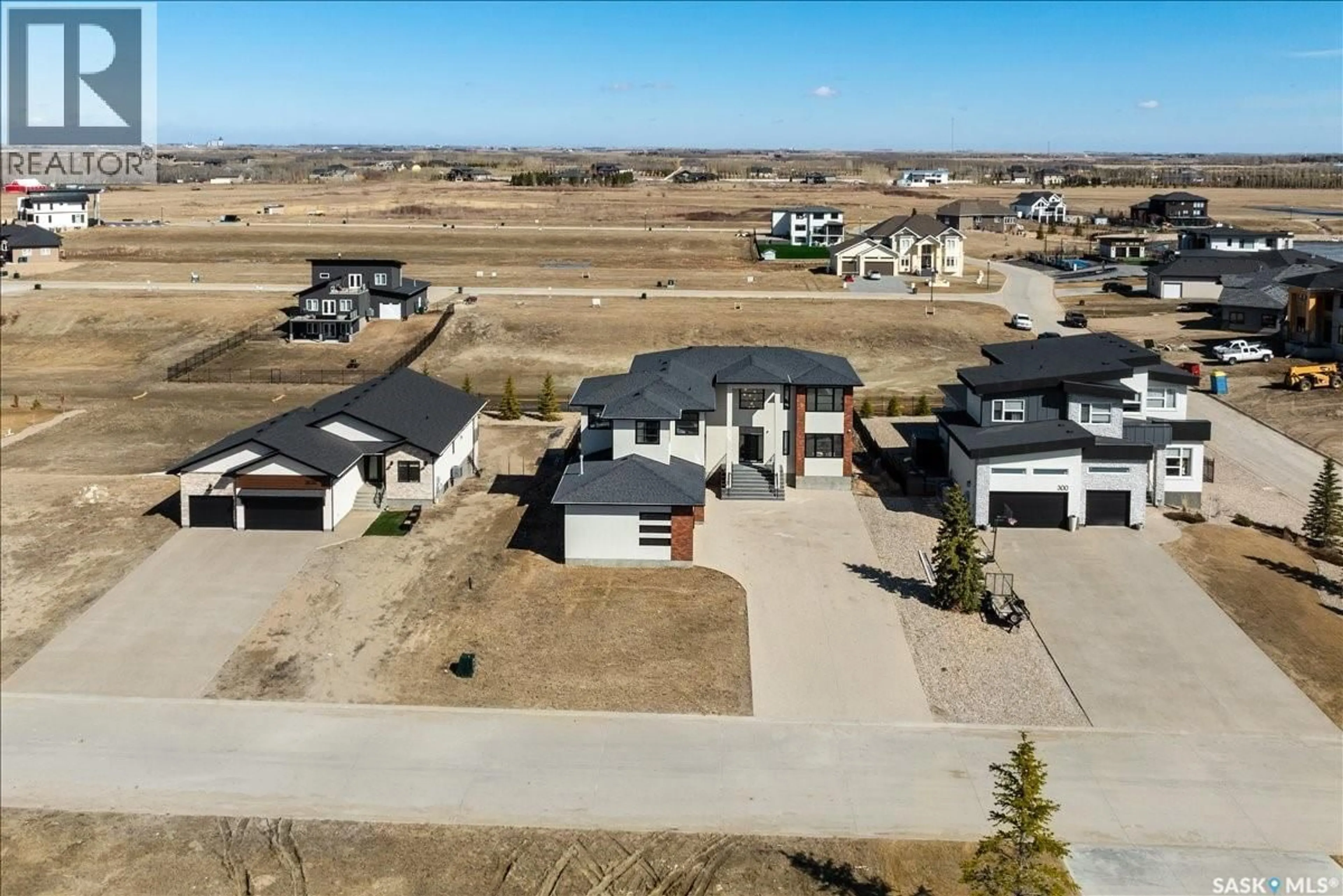 A pic from outside/outdoor area/front of a property/back of a property/a pic from drone, street for 304 SPRUCE CREEK CRESCENT, Edenwold Rm No.158 Saskatchewan S0G3Z0