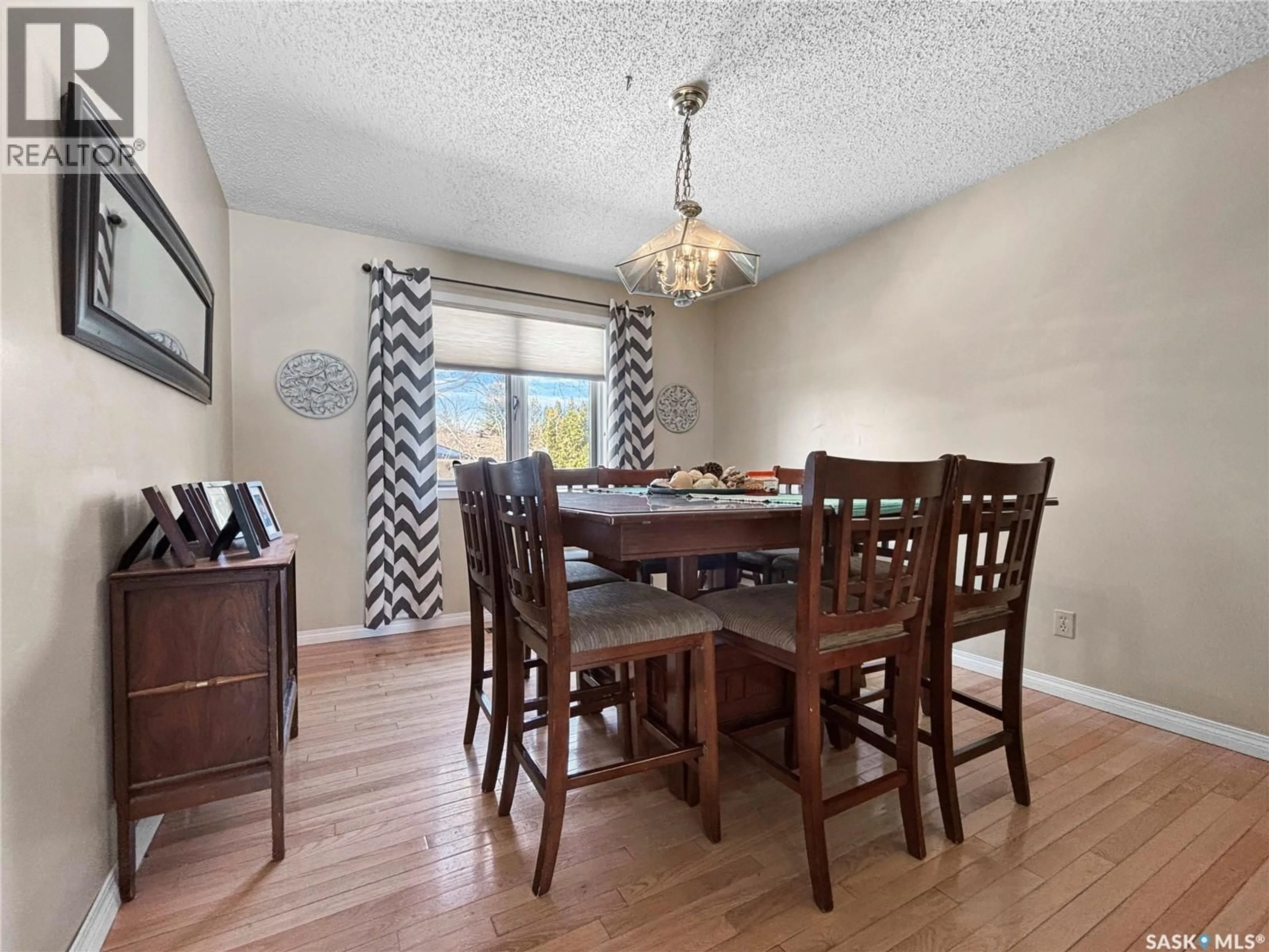 Dining room, wood/laminate floor for 302 NOKOMIS PLACE, Saskatoon Saskatchewan S7K5E2