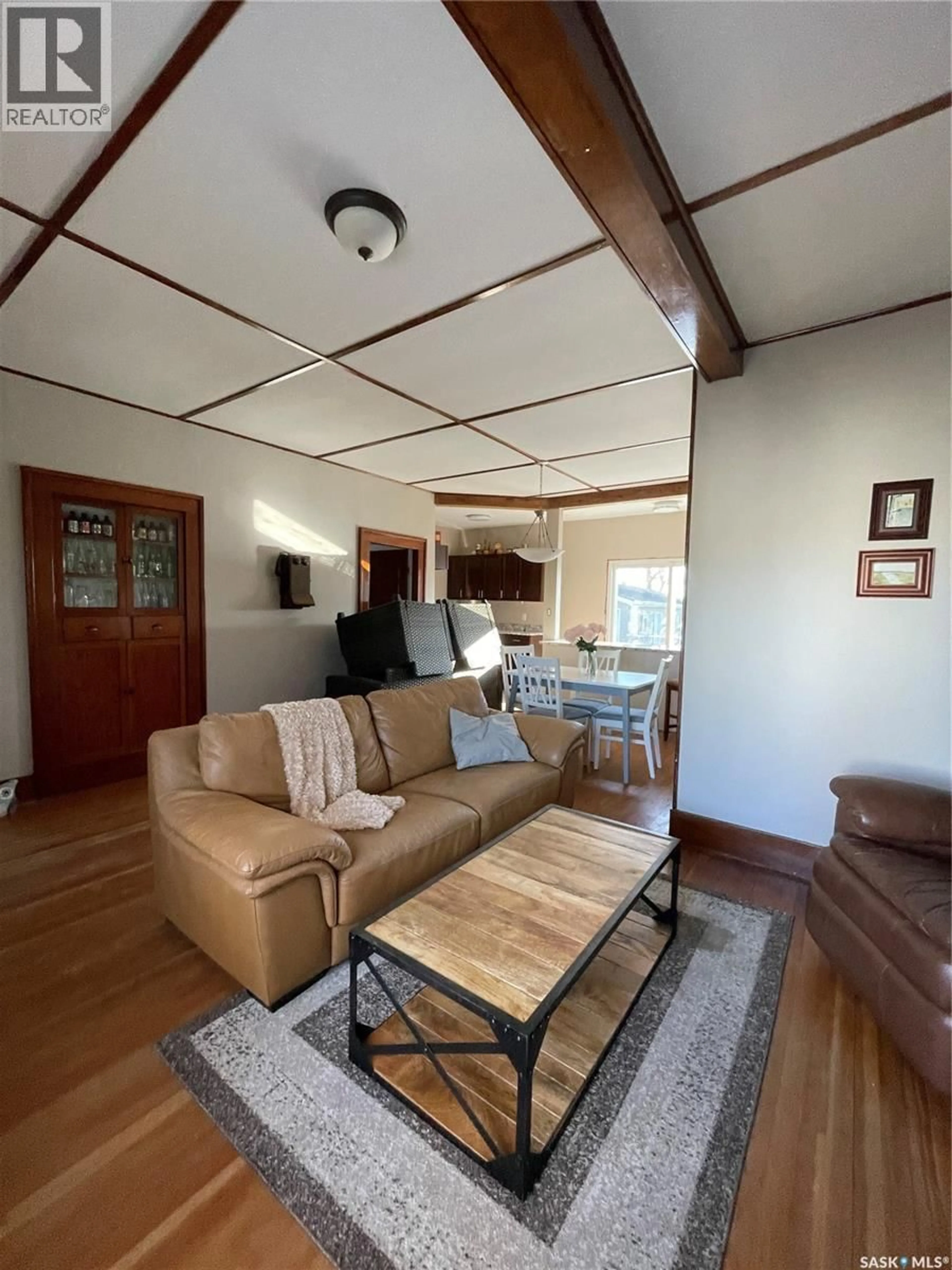 Living room with furniture, wood/laminate floor for 107 MISTUSINNE STREET, Mistusinne Saskatchewan S0H1J0