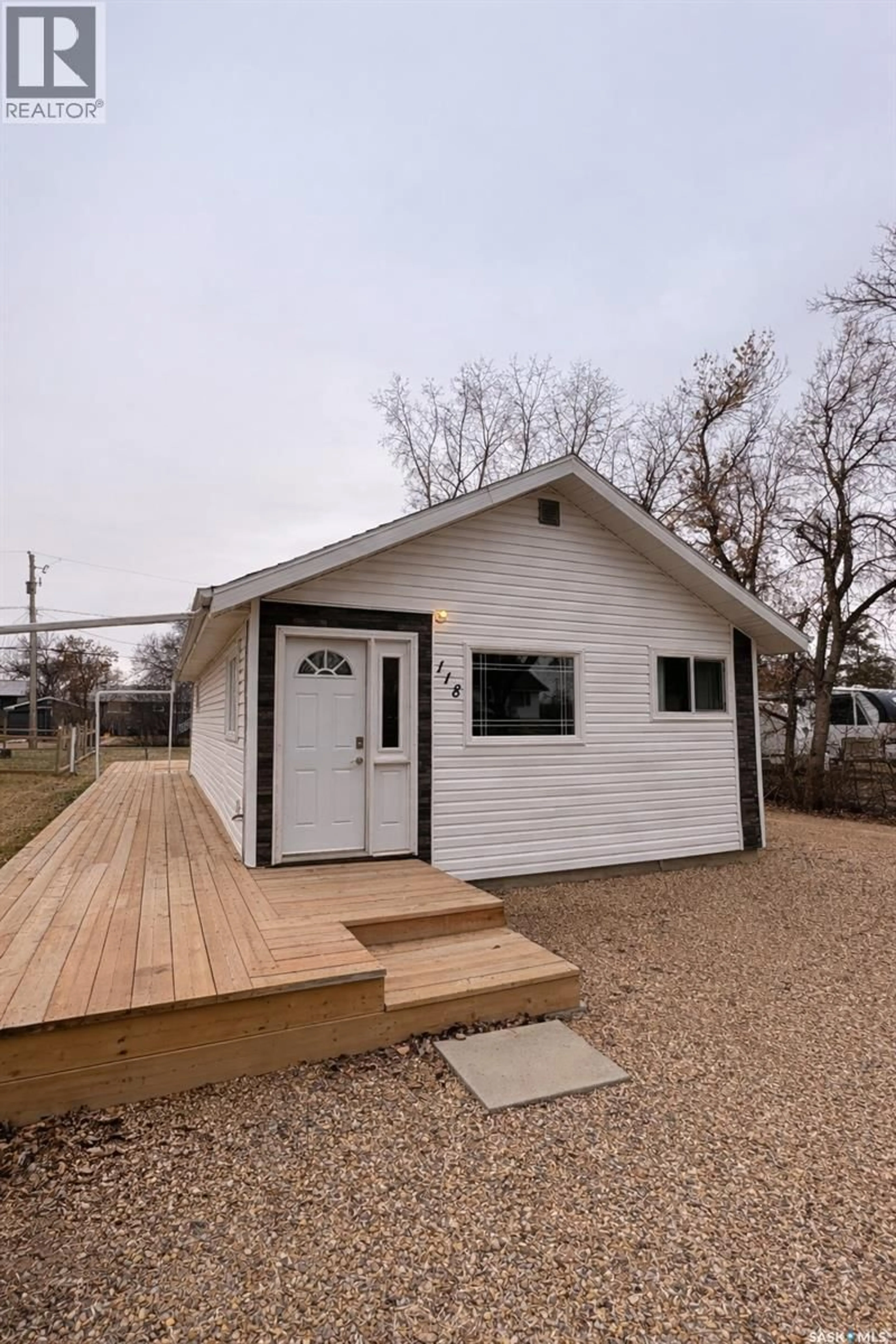 Home with vinyl exterior material, street for 118 2ND STREET, Lafleche Saskatchewan S0H2K0