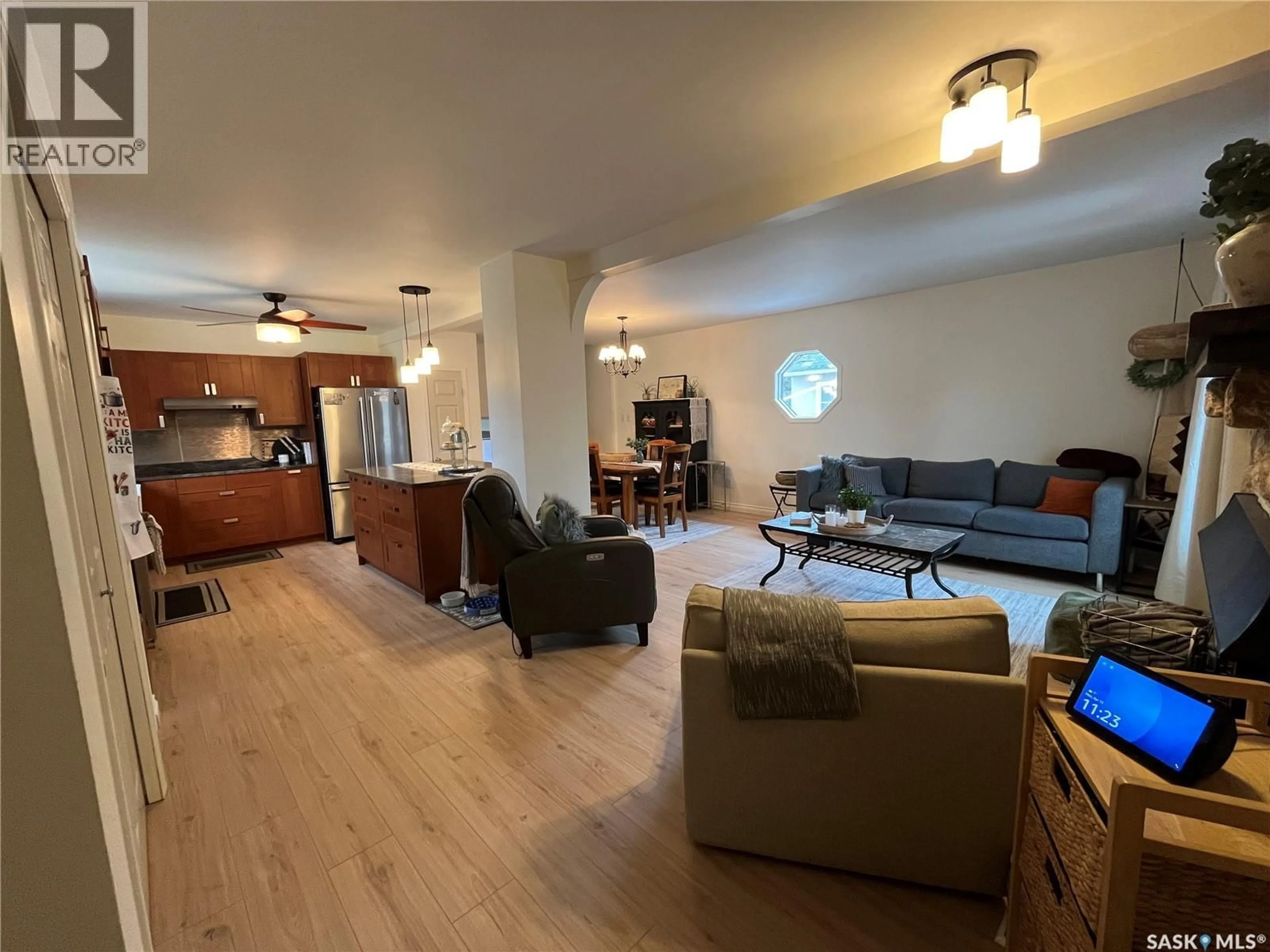 Living room with furniture, wood/laminate floor for 1131 111TH STREET, North Battleford Saskatchewan S9A2K4