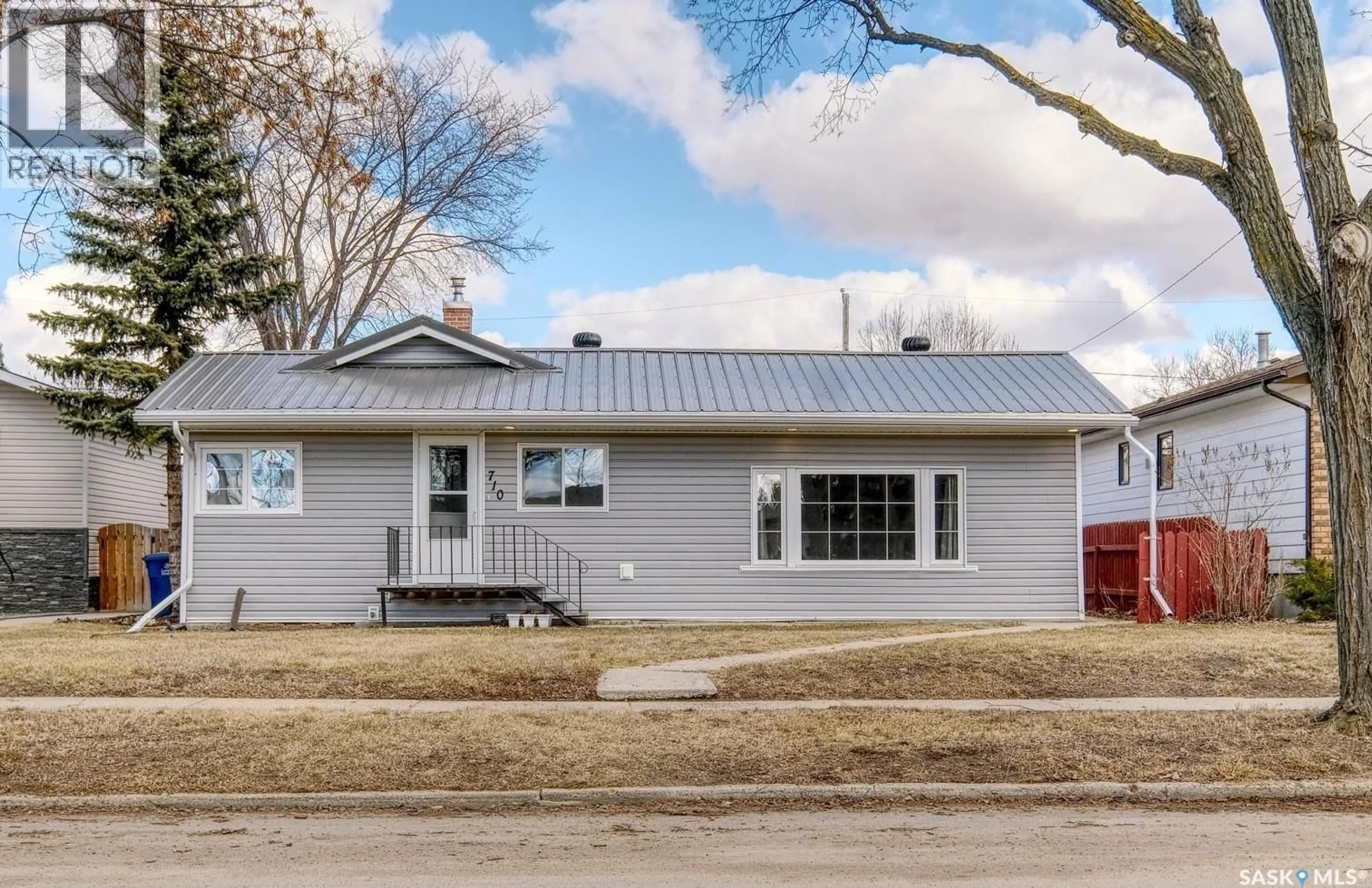 Home with vinyl exterior material, street for 710 MAIN STREET, Rosetown Saskatchewan S0L2V0